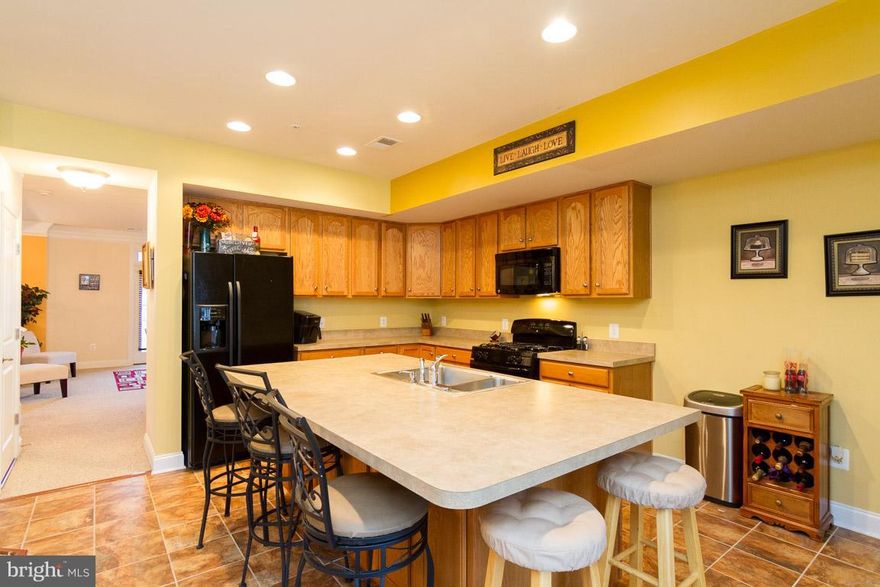 Cheerful 3 bedroom 2.5 bath 2 story condo in the gated Potomac Club Community. Spacious eat-in kitchen with center island, double sink, plenty of counter top space and so much storage. This home features a private office, family room, dining room, master suite and large guest bedrooms. Master bedroom with two walk-in closets, two bathroom vanities and a huge shower with seating. It's a gem!