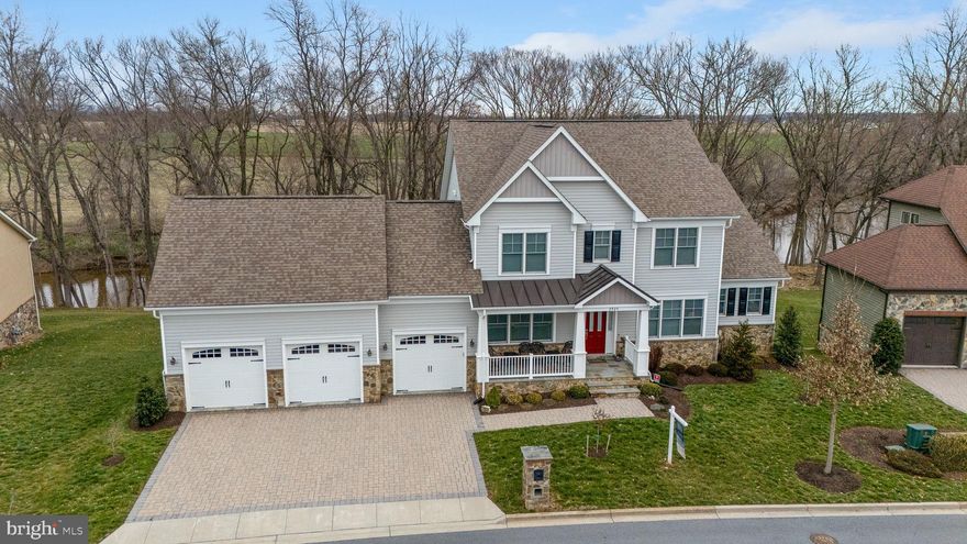 See Virtual Tours link at top of listing; The River View Estates at Mill Island - this customized home offers unobstructed River views and scenic vistas - 2 private decks and full walk-out lower level with full size windows and 2 double walk-out exits, this unfinished space has a full bath rough-in and rough-in for a wet bar. Enter from a covered front porch and you are greeted by an open plan with huge windows to a large open porch taking advantage of the sweeping views from a 2-story great room with fireplace. The GR is open to the kitchen with a 10-foot island perfect for gathering, and an informal dining room/breakfast room with walls of windows to take advantage of the scenic water views. Off the kitchen is a large mudroom, walk-in pantry, and private deck tucked behind the garage perfect for morning coffee. A main level primary suite is complimented by walk-in closet and spa bath with free standing soaking tub and huge walk-in shower plus additional closet storage! Ascend to the second level from an atrium room/open staircase to the second level with 3 additional bedrooms and 2 baths. Truly a remarkable setting, home and community. Located on Mill Island with a large nature preserve, enjoy a quiet neighborhood bounded on one side by the Monocacy River and the other by Tuscarora Creek; once you cross the bridge onto the island leave your cares behind. No thru traffic, miles of paved marsh trails in a protected wildlife area to jog or stroll offer a sense of quiet solitude. There is also an area to launch kayaks on the Monocacy side. Resort amenities include a clubhouse featuring areas to lounge and entertain, a gym, Game room, locker rooms, library, adult pool, kids pool, lap pool, tennis courts and putting green. Stroll to the Worman's Mill Town Center for indoor and outdoor dining at local restaurants, convenience stores, a town square with outdoor weekend summer concerts and food trucks.