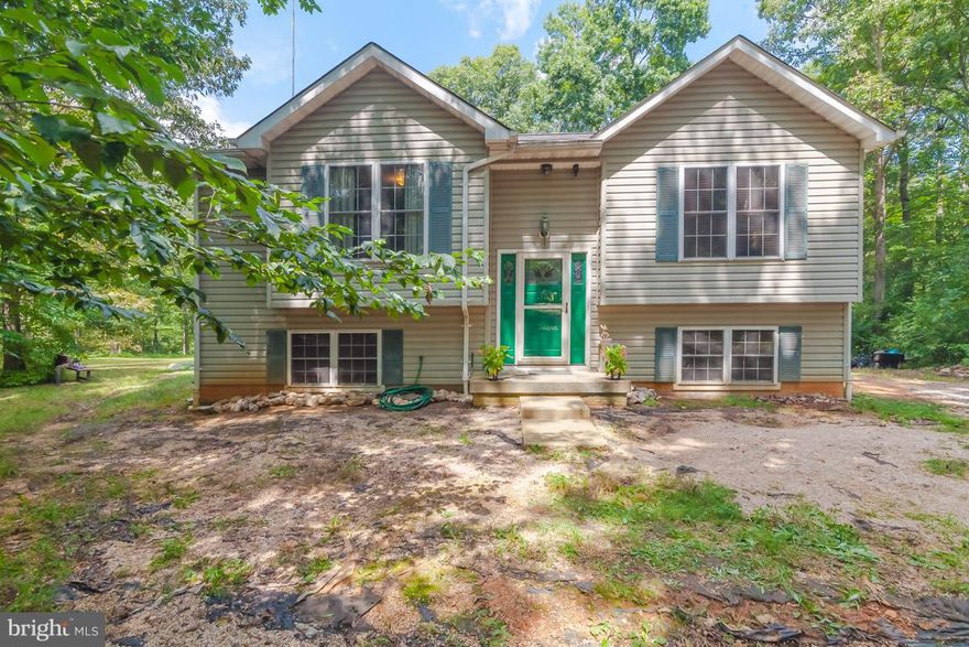 This four bedroom home sits on over 3 private acres with 350 feet of water frontage on Black Walnut Run Creek.  Updated kitchen with new cabinets and stone/glass back splash. Wood laminate floors on main level.  Spacious family room and dining combo.  High efficiency heat pump and smart hot water heater installed in 2014.