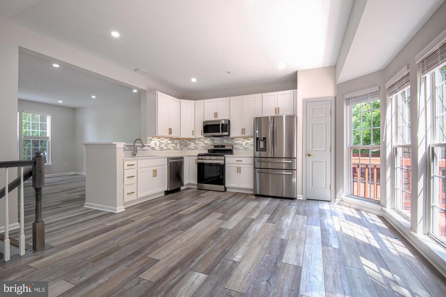 Updated, Top to Bottom!!  New Luxurious Vinyl Plank Floors on All 3 levels.  Fully Updated Kitchen with New Cabinets, Quartz Countertop, New Stainless Steel Kitchen Appliances.  Fully Updated Luxurious Bathrooms: Primary Bathroom and Hallway Bathroom on upper level.  Freshly Painted throughout with neutral color.  New Roof (7/2023).  Updated HVAC (7/2020).  Freshly painted Deck.  Backing to woods.  Walkout Level Basement has a Family Room, Den, 3rd Full Bath,  Gas fireplace, and Laundry Room.  2 Assigned parking spaces (#73, one at front of the house and the 2nd one at nearby).   Great Schools.  Great Location, close to shopping centers and restaurants on Rt 40 and easy access to Rt 29, 70 & 100.  Strictly No Smoking, No Pet.  Minimum 2 Year Lease and 680+ credit score required by the landlord.