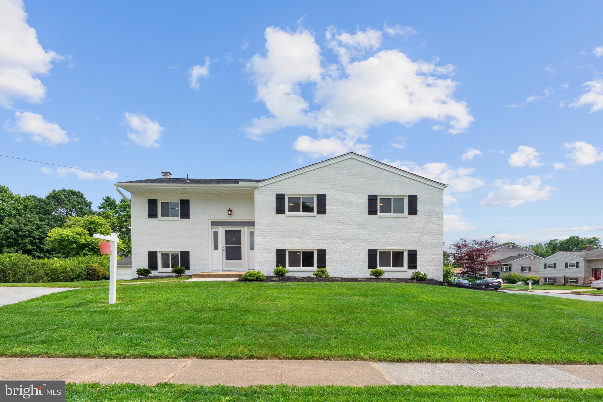 Welcome to this completely remodeled, move in ready transitional home in Perry Hall Village. Everything has been upgraded to new in 2024/2025. Roof (2024) Windows (2024) Insulated Vinyl Siding (2024) Hot Water Heater, Gas Furnace, and Air Condition ( All in 2024) Stunning Modern Farmhouse style white brick front with black shutters. The main level is full of natural light that shines over your warm and welcoming family room and dining room and hardwood floors throughout. New kitchen with WoodMode Custom cabinets, Quartz countertops with island seating, and all new stainless steel appliances. Dining area leads out to a New 13 x 26 composite deck. Main level provides 3 upgraded Bedrooms with all new modern solid interior doors and trim, ceiling fans, and fresh paint. Master bedroom has tons of closet space with built-in cabinet with ample shelving. Completely remodeled bathroom with heated tile floor, extra long tub with shower. Large vanity with drawers, quartz top, and separate hair and make-up area. The inviting lower level has been completely remodeled with New Luxury Vinyl Plank flooring throughout. Plenty of natural light with a wood burning fireplace. Gas and electric have been roughed in to fireplace for optional Gas Fireplace or insert. A large kitchenette combined with washer and dryer, refrigerator, and microwave serve as a 2nd kitchen. New full bathroom with custom shower and glass shower door and large vanity with drawers. Lower level also includes a 4th Bedroom making this level capable of serving as a multi-generational home. The walk out sliding door opens onto a 14' x 26' covered and dry patio with another 14' x 12' of open patio for fire pit and grill area. This highly sought out quiet neighborhood offers great access for biking. It's located in just around the corner Snyder Lane Park that offers fields, open space, sand volleyball, and playground. Don't miss out on this beautiful, move-in ready home.