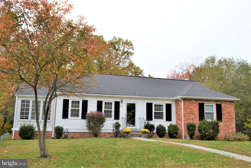 Charming Brick Rambler located on a cul-de-sac.  Enjoy your morning coffee on the new deck that overlooks the woods or in the Sun Room.  Hardwood Floors on the main Level.  Full Bath on the main level and Basement.  Freshly Painted.  Close to Old Towne. Close to King Street Metro. Great school district!  ***Fireplace Does Not Work***