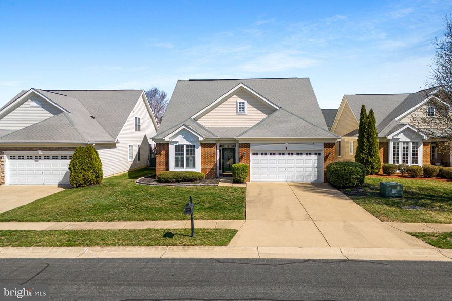 Welcome home to this wonderfully maintained home in Virginia Heritage at Lee's Parke! This home features a main floor primary with ensuite bathroom as well as a second main floor bedroom and full bath.  A beautiful dining room with crown molding and chair railing leads to a living area and sunroom that feature a double-sided gas fireplace and lead out to a covered, and an uncovered, TREX deck in the fenced rear yard.  A second level includes a large third bedroom, full bathroom and spacious loft that overlooks the main level. The amenities for this active adult community include an 18,000sq ft clubhouse with an indoor pool, billiards, a game room, a library, and coffee bar, as well as an outdoor pool, tennis and pickleball courts and so much more. Call today to be make this your new address!