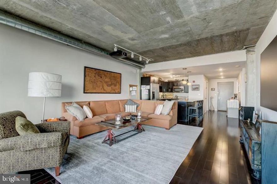 Gorgeous 1 bedroom 1.5 bath condo in Silo Point with incredible views of the city. Spacious gourmet kitchen with center island and breakfast bar, stainless steel appliances and granite counter tops. The kitchen opens to the contemporary style living room with custom projector and screen, wood floors and expansive windows, with amazing views of the city! Over-sized master bedroom with attached full bath, with dual vanity and separate bath and shower. Laundry room in unit, and two parking spaces convey. Silo point offers tons of amenities, some of which include the Sky lounge, with an expansive terrace over looking the water, fitness center, game room, meeting room and concierge.