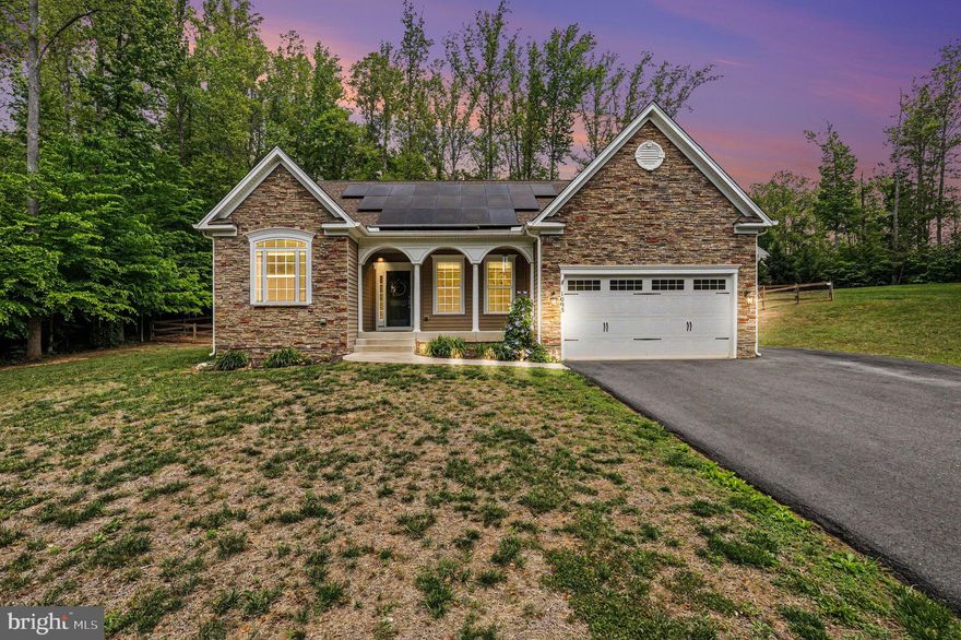 Experience the charm of country living while enjoying close proximity to modern-day conveniences in this beautifully maintained 4-bedroom, 3 bath home. Designed for both comfort and functionality, the open floor plan seamlessly connects the kitchen, dining, and living areas—perfect for everyday living and entertaining. The spacious kitchen features abundant counter space, ample cabinetry, and a large island ideal for gathering. A stunning stone gas fireplace anchors the living area, creating a warm and inviting focal point. Retreat to the generous primary suite featuring two walk-in closets and plenty of space to unwind. Endless possibilities await in the finished lower level, featuring stylish wood-look tile flooring and thoughtful lay-out.This level includes a private bedroom and full bathroom—ideal for guests or multigenerational living—along with a dedicated hobby room perfect for crafts, fitness, or a home office, and large rec room.Situated on a spacious lot, the fenced backyard offers room to relax, play, or entertain outdoors.Thoughtful upgrades enhance both efficiency and peace of mind, including solar panels to help reduce energy costs, gutter guards for low-maintenance living and added home protection, and a brand new hot water heater.  Enjoy the best of both worlds—peaceful country living with shopping, dining, medical offices, and commuter routes just a short drive away.