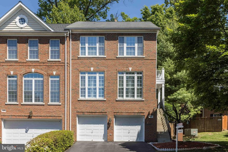 Location! Location! Location! Beautifully maintained end-unit townhome backing to trees in the highly sought-after Parkside at Fairfax Center community! Enjoy an unbeatable location directly across from Wegmans and just minutes from Fairfax Corner, offering endless dining, shopping, entertainment, and everyday convenience right at your doorstep.
This spacious 4-bedroom, 3.5-bath home offers the perfect blend of comfort, privacy, and modern updates. The upper-level HVAC was replaced in 2022, while the lower-level HVAC and hot water heater were updated 7 years ago for added peace of mind. The lower level also features brand-new carpet and a walk-out basement design, creating an ideal private space for guests, an in-law suite, home office, gym, recreation room, or additional independent living area.
The main level showcases a bright two-story foyer, hardwood floors throughout, elegant crown molding, plantation shutters, and a spacious dining/living area filled with natural light. The kitchen offers stainless steel appliances, generous cabinet storage, and functional space ideal for both everyday living and entertaining. The adjoining family room with gas fireplace creates a warm and inviting atmosphere.
Step outside to a private deck overlooking peaceful wooded views with direct access to the Government Center Trail-perfect for walking ,jogging ,biking and enjoying nature right from your backyard. The fully fenced backyard offers additional privacy and outdoor enjoyment.
Upstairs, the luxurious primary suite includes a spa-inspired bath renovated in 2021 with a large walk-in shower, dual vanity, and customized walk-in closet. Additional bedrooms are generously sized with abundant natural light.
A dedicated EV charging station is already installed — a valuable modern upgrade for electric vehicle owners, allowing convenient at-home charging without additional installation costs.
Additional highlights include a 2-car garage, upper-level laundry, and thoughtful updates throughout. Move-in ready and beautifully cared for, this exceptional home truly has it all!