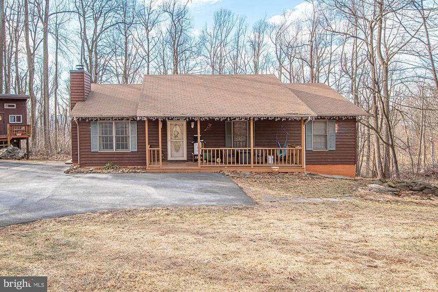 Nestled on the scenic slopes of Blue Mountain in Linden, Virginia, this charming rambler sits on a private .54-acre lot and offers space, flexibility, and fun at every turn. The main level features 3 bedrooms and 2 full baths, providing comfortable everyday living, while the finished basement includes two additional rooms ideal for potential bedrooms, home offices, or guest spaces and also a finished bathroom.
The lower level truly steals the show with a large playroom designed for adventure, complete with a custom Nerf gun wall, imaginative hideouts, a slide, and two swings—perfect for hours of entertainment. Outdoors, the fun continues with two playground sets and a whimsical tree house, making this property a dream for play, relaxation, and memorable gatherings.
Adding to its appeal, the home is located in a community that offers access to a private lake and a lodge available for rent, ideal for hosting events, gatherings, or enjoying peaceful days by the water.  Also, 1/4 mile drive to the Appalachian Trail, where in May you can see the highest concentration of White Trillium bloom on the East Coast. Surrounded by nature yet conveniently located, this home blends mountain charm with versatile living spaces—an ideal retreat for those seeking room to grow, play, and unwind.