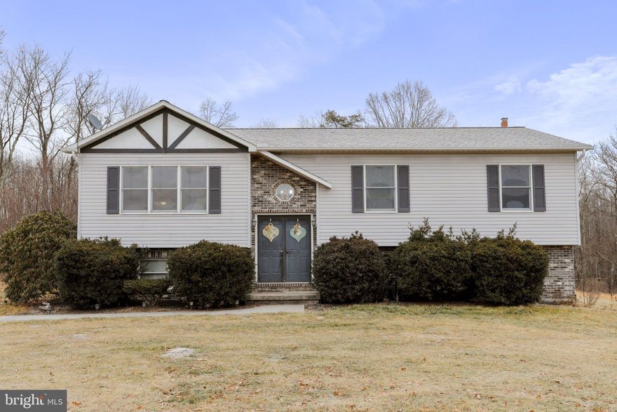 Hidden Retreat in the Hills of Hampshire County, West Virginia! Discover the timeless charm of this Split Foyer residence, boasting over 2,400+ finished sq. ft., 4 bedrooms, 2 full bathrooms, and a partially finished basement. Your private sanctuary awaits on a vast 7.97-acre property, seamlessly blending expansive park-like settings with dense hardwoods for hunting and privacy, crowned by a picturesque pond. Step into the warmth of a thoughtfully designed Split Foyer layout, ensuring seamless transitions between living spaces. The home’s 4 bedrooms provide ample space for family or guests, complemented by two full bathrooms designed for comfort and convenience. The partially finished basement offers flexibility for additional living space, a recreation area, or a home office. Where else but Hampshire County can you find the best of both worlds? Enjoy the openness of a retreat-like setting and the seclusion provided by dense hardwoods, perfect for hunting. Your haven is complete with an attractive pond ready for fishing or simply a place to relax. Revel in the seclusion that comes with almost 8 acres of land, offering an escape from the hustle and bustle of city life. Explore the diverse landscape, from open spaces to wooded areas, creating a sanctuary from everyday life. Despite the secluded feel, you're only 40 minutes away from Winchester, VA, providing easy access to employment, health care, and retail therapy. Seize this opportunity to own a piece of West Virginia's hidden beauty.