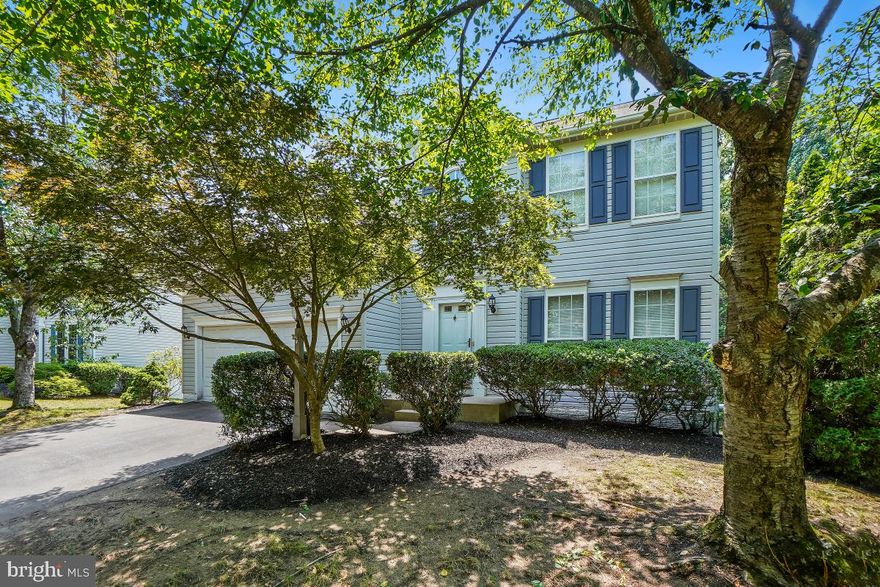 Welcome to 8114 Bell Tower Crossing! This spacious home includes over 3,000 square feet of living space on 3 finished levels. The home backs to a conservation area offering tons of privacy. Enjoy 4 bedrooms and 3.5 bathrooms with an attached 2 car garage. The main level boasts hardwood floors and formal living and dining rooms. There is an open concept family room and eat-in kitchen. The family room has a cozy gas fireplace. The eat-in kitchen offers stainless steel appliances including a gas range, ample cabinetry, and island with breakfast bar seating. The kitchen overlooks the large sunroom with views of the lush tree line and access to the back deck ideal for entertaining. The upper bedroom level includes 3 beds and 2 baths. The primary suite has a walk-in closet and ensuite bath. The ensuite features a soaking tub, walk-in shower, and double sink vanity. The secondary bedrooms are both well-appointed and share a full bath. The lower level is finished with a large rec room including a built-in bar. There is a walk-out to the back patio and yard as well. The lower level also includes a large laundry/storage room, full bath, and additional bedroom. Ideally located minutes to shopping, restaurants, and transit. Community amenities include Club House, Swimming Pool, Playgrounds, Walking Paths, and much more. Schedule your showing today!