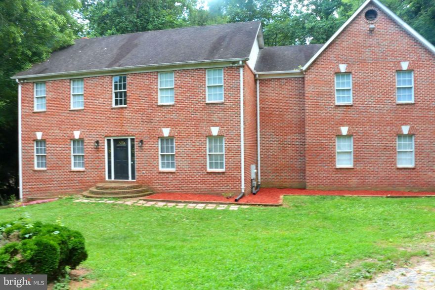 Investor Special – Cash Offers Only!
Priced to move quickly, this custom brick home on nearly three private acres offers endless potential for the savvy buyer or investor. With strong bones, beautiful hardwood floors, and a modern open-concept layout, this property is a golden opportunity to finish what’s been started and make it your own. The main level features a spacious kitchen with a brand-new quartz countertop and a 10-foot island complete with a quartz farmhouse sink.

The primary suite includes a large bathroom, walk-in closet, and a cozy sitting area, while a second master bedroom and basement await your finishing touches. The home includes three HVAC systems and a multi-level deck, both needing repair, along with other minor cosmetic updates—perfect for those ready to add value.

Imagine completing the expansive deck to overlook the serene backyard, or transforming the unfinished 1,675 sq. ft. basement into additional living space, a guest suite, or an entertainment area. With no HOA restrictions, ample parking, and incredible potential to become a 5+ bedroom, 4.5-bath home, this property is ready for your vision.

Don’t miss this rare opportunity to bring this Upper Marlboro gem to life—cash buyers only and priced to sell fast!