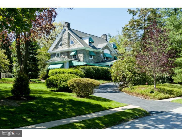 A true Main Line stone Classic in every sense of the word, that was designed by well known Philadelphia architect, Henry L. Reinhold. This magnificent grand old dame is rich in history and has graced the South Wayne community for over 100 years. Masterfully constructed in 1905 for Charles Sheaffer, the vice president of Pennsylvania Railroad, it was one of the first homes in Radnor built to live in year round. The stunning wrap around porch and signature awnings remain true to its history and continue to embody the soul of the house. A elegant Foyer that is streaming with natural sunlight was known as the entertaining room that gracefully flows into the expansive formal rooms of the house with millwork of a by-gone era and gleaming hardwood floors. A lovely Sunroom is perfect for morning coffee or a late afternoon nap as it brilliantly captures our four seasons. A large Family Room with Fireplace perfect for todays active lifestyle conveniently flows into a Butlers Pantry and updated country Kitchen. Additionally, there is a Breakfast Room with Mudroom providing access to the beautiful backyard. A grand staircase leads one to the Second Floor where there is a gorgeous Master Suite and luxurious Master Bath. There are three additional spacious Bedrooms, two updated Full Baths and a wonderful Study with magnificent outside upper deck overlooking the stunning backyard. The Third floor has four additional Bedrooms and two Full updated Baths. What estate would be complete without a matching 2,000 sq ft. Carriage/Garage House with updated heating and electrical systems. This truly special property has only been lived in by three separate families and is the second time in its history to be offered for sale. Don't miss this opportunity to own one of the Main Line's classic beauties with a "Walk To Wayne" address!!