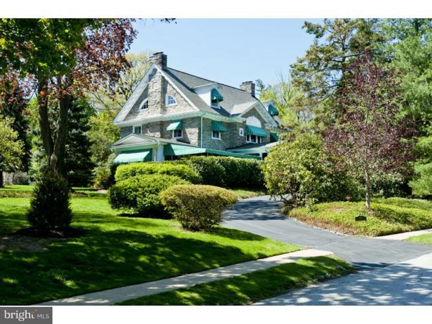 A true Main Line stone Classic in every sense of the word, that was designed by well known Philadelphia architect, Henry L. Reinhold. This magnificent grand old dame is rich in history and has graced the South Wayne community for over 100 years. Masterfully constructed in 1905 for Charles Sheaffer, the vice president of Pennsylvania Railroad, it was one of the first homes in Radnor built to live in year round. The stunning wrap around porch and signature awnings remain true to its history and continue to embody the soul of the house. A elegant Foyer that is streaming with natural sunlight was known as the entertaining room that gracefully flows into the expansive formal rooms of the house with millwork of a by-gone era and gleaming hardwood floors. A lovely Sunroom is perfect for morning coffee or a late afternoon nap as it brilliantly captures our four seasons.  A large Family Room with Fireplace perfect for todays active lifestyle conveniently flows into a Butlers Pantry and updated country Kitchen. Additionally, there is a Breakfast Room with Mudroom providing access to the beautiful backyard. A grand staircase leads one to the Second Floor where there is a gorgeous Master Suite and luxurious Master Bath. There are three additional spacious Bedrooms, two updated Full Baths and a wonderful Study with magnificent outside upper deck overlooking the stunning backyard. The Third floor has four additional Bedrooms and two Full updated Baths. What estate would be complete without a matching 2,000 sq ft. Carriage/Garage House with updated heating and electrical systems. This truly special property has only been lived in by three separate families and is the second time in its history to be offered for sale. Don't miss this opportunity to own one of the Main Line's classic beauties with a "Walk To Wayne" address!!