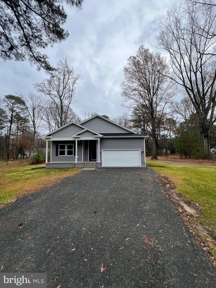 Construction Completed Ready to move in . Builder Offering Some Incentives!! Call Listing Agent for More Info. Welcome to your New Home in Cabin Point Neighborhood !!One of the best kept secrets in Northern Neck Area. This Modern Farmhouse beauty sports a lovely front façade full of energy and bright design elements.  front covered porch and overhead gables  The front loading garage holds vehicle space for two automobiles and leads into the family laundry room for a tidy home environment.
The interior floor plan features approximately 1,552 square feet of living space on one floor with three bedrooms and two baths. Entry into the home from the front porch features access into the two secondary bedrooms and shared hall bath. Both bedrooms feature window views and ample closet space while the shared bath offers a tub/shower combination, a toilet area and vanity. Located diagonally across the floor plan is the owner’s suite with a spacious bedroom and an ensuite bathroom with both a garden tub and separate shower. Additionally, there are dual vanities, a compartmentalized toilet room, and a linen closet before stepping into the walk-in closet. The main living areas consist of a large open space that includes a family room, a dining room with sliders to the outdoor12x16  Deck area with trex floor a kitchen with an angled island and corner walk-in pantry. Almost  1/2 of Acre of Land in the Cul-de-sac location House is just a short stroll away from the 2 beaches and is Located in the Water Orientated Community of Cabin Point with great amenities including: Three Sand Beaches, Tennis Courts, Swimming Pool, Boat Ramp,& Clubhouse. Cabin Point is a popular neighborhood in Westmoreland County Virginia, less than 2 hours away from DC and Richmond, Some of the Upgrade for the House are ; SS Appliances ,Granite Counter top, Hardwood floor or Luxury Vinyl Planks ,Tile in the Bathrooms Upgrade trim Recessed Lights and much more . Listing Agent Related to Seller