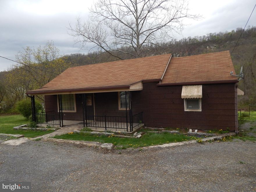 Rancher in North Berkeley Springs with large front and back yards.  Home features 3 BR, 1 BA on the main level, along with a living room, dining room and Kitchen.   Cellar with full bath and laundry hookup.  Front Porch.  Storage building with dirt floor.  Property adjoins proposed rail trail.
