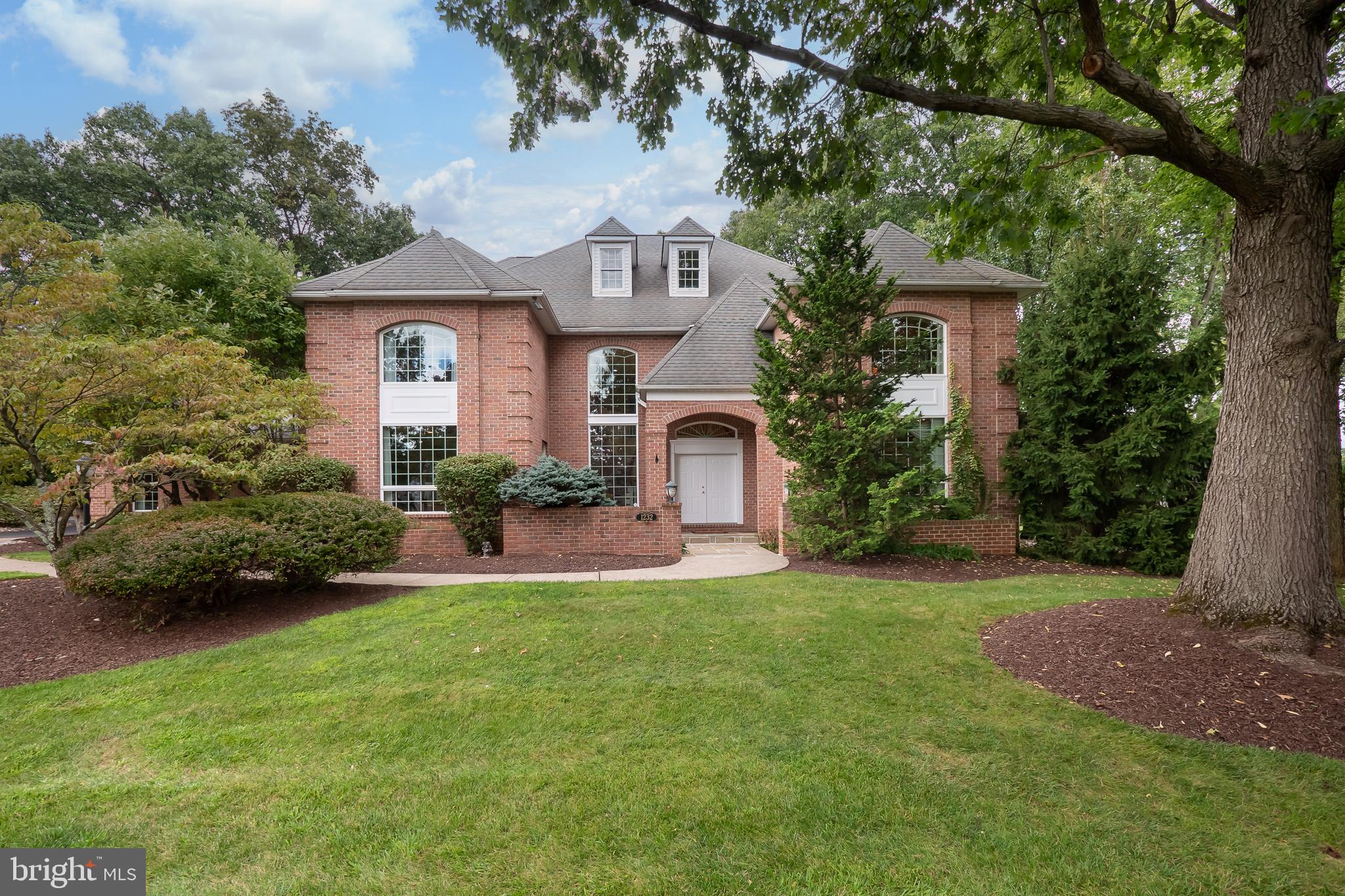 Welcome to this STUNNING masterpiece, where LUXURY MEETS COMFORT with plenty of room to spread out and enjoy. This exceptional 5+ bedroom, 7 bathroom residence is designed to impress from the moment you step through the GRAND 2-STORY FOYER, featuring a SWEEPING DOUBLE STAIRCASE that makes a striking first impression. Every detail has been METICULOUSLY CRAFTED to offer the finest in upscale living. The expansive 1st level boasts a light-filled kitchen + BREAKFAST NOOK open to the family room, featuring wall-to-wall built-in bookcases & gas fireplace. Off the kitchen is the EXTRAORDINARY INDOOR POOL ROOM, a true oasis of relaxation. Here, you’ll find a SPARKLING POOL surrounded by elegant BLUESTONE FLOORING, a soothing spa, and CASCADING WATERFALL, perfect for unwinding after a long day or hosting unforgettable gatherings. A guest bedroom ensuite, TWO PRIVATE OFFICES, and mudroom/laundry room w/full bath complete the 1st level. The 2nd level PRIMARY SUITE includes a LUXURIOUS AND RELAXING bath with MARBLE TILE flooring, walk-in shower, soaking tub, and TWO WALK-IN CLOSETS. Five additional spacious bedrooms, two of which have PRIVATE LOFTS, are ideal for family & guests. A circular driveway, 4-CAR GARAGE, mature trees & landscaping, and PRISTINE bluestone backyard paver patio. Don't miss the opportunity to own this EXQUISITE PROPERTY, where every element has been thoughtfully curated to provide the ultimate in elegance and comfort. Just 5 minutes to ST. LUKE'S AND LVHN HOSPITAL CAMPUSES, GOLF, shopping + commuter routes I-78, 33, and 22.