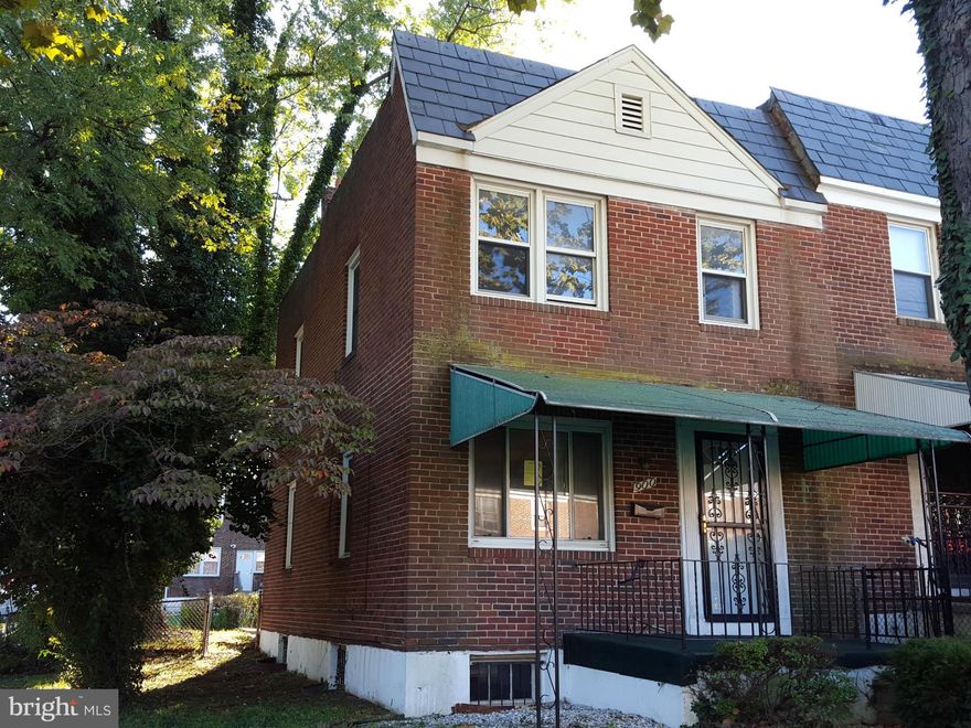 End unit treasure! This home offers great potential with a solid start. The home is a traditionally styled, all brick end home. The home has extra light from side windows, a nice fenced yard, and parking in the rear. The basement is part finished.  The main level offers a large living and dining area. Come take a look and bring your best offer!