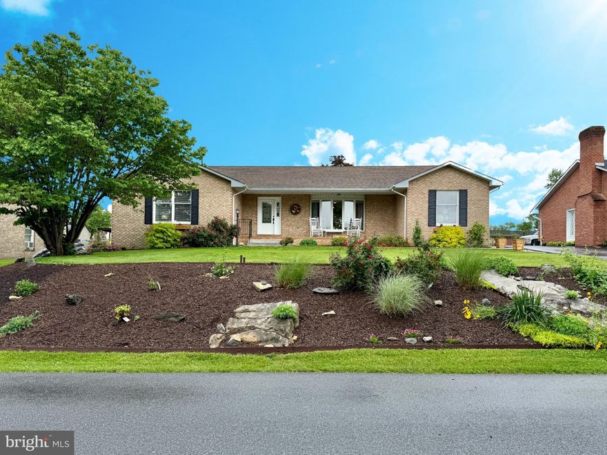 Beautiful brick rancher in a most convenient location.  Close to everything but in an established neighborhood.  New flooring throughout, freshly painted and even a little stylish wallpaper here and there. New countertops in the open kitchen with a generous dining area.  Oversized living room for entertaining with door opening to the covered carport with outside living area.  Primary bedroom has two walk in closets and a large bath with a soaking tub, shower and vanity area.  Second bedroom has double closets and large window for tons of natural light.  Third bedroom has it's own bathroom with a new vanity and huge walk in closet.  This room could be a very nice family room if bedroom not needed or would also make a nice in-law suite area.  Large garage with extra storage and another huge storage area that was once a workshop.  Raised beds and a wonderful perennial garden make this backyard a beautiful sitting area.  So many improvements make this house a must see!!