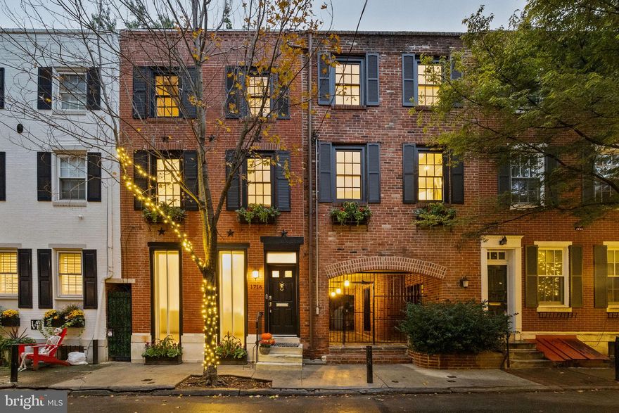 BACK ON MARKET - Buyer financing fell through at the last minute. No fault on the property. Please reach out to listing agent for inspection report. Welcome to 1716-18 Addison Street, a one-of-a-kind double wide on Philadelphia’s most picturesque, tree-lined street. This townhome was thoughtfully updated maximizing space without sacrificing historic character. Spanning 2,600+ SF and 33 ft wide, this home consists of 3 bedrooms, 3.5 baths, a newly finished basement, and an over-sized back patio. Upon entering the home, you are greeted with a sun filled living space with 9 ft ceilings, brand new oak floors, crown moulding, fireplace, and charming back patio double doors. Walk down the steps to the finished basement with full bath – the perfect, private bedroom suite for overnight guests. Walk up the steps to the conjoined second floor where the living room, dining room, and kitchen all seamlessly connect. The second floor includes a half bath, laundry closet with washer/dryer and shelving, two fireplaces, a bar area with ample storage and pull out shelving, and a rear deck overlooking the back patio below. The custom kitchen includes all new appliances and updated cabinetry. There are two staircases up to the third level – one that leads to the primary, and another that leads to the second and third bedrooms. The primary bedroom is sizable with vaulted ceiling, exposed brick, and a wall of closets with overhead storage. The primary bath includes a large soaking tub. The second and third bedrooms can be accessed from the primary as the entire third level is also conjoined. The second and third bedrooms are sizable and can serve a variety of needs such as work from home office, additional closet space, and nursery. There is one full bathroom with standing shower off the second and third bedrooms. The charming brick underpass is a unique feature of the home providing direct access to the back patio and street. Within this underpass is a door leading to more closet space as well as another basement housing utilities. There is also a separate trash closet within this underpass. The owners are offering to transfer their ONE CAR PARKING spot in a lot at the beginning of the block. This is a home you don’t want to miss - schedule your tour today!