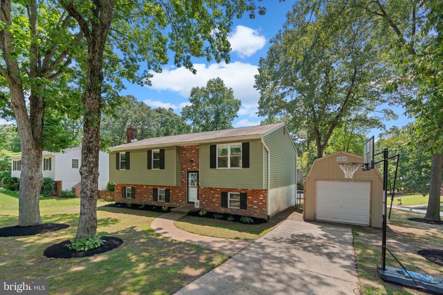 OPEN FLOOR PLAN -- FULLY RENOVATED -- PREMIUM CORNER LOT! Welcome to 300 Tennessee Ave in Boulevard Park! This move-in ready home will speak to the buyer who appreciates modern finishes, desires a large flat/cleared rear yard, and who values a well-established community.  Open floor plan on main level -- Gourmet kitchen 2020 w/ beverage cooler, granite counters, stainless steel appliances -- Guest bathroom 2020 -- Primary bathroom 2024 -- Lower level bathroom 2020 -- LVP Flooring 2020 -- New Gutters & soffit 2020 -- Ceiling fans & light fixtures 2020 -- New water treatment system 2020 -- Septic treated 2023 -- New windows 2020 -- Massive shed 2024 -- New well tank 2024 -- Water heater 2024 -- Washer/dryer 2024 -- Recessed LED lighting -- Professional quality window coverings -- Ample parking -- Above grade in rear of home for full daylight in basement -- Unfinished storage space for home gym or wood shop -- Bonus fourth bedroom/office on lower level -- Anderson sliding glass doors -- Anderson storm door -- Keyless entry --Boulevard Park is a high-demand waterfront community situated on the Lake Shore peninsula in Pasadena. Managed by the Boulevard Park Improvement Association (BPIA), the neighborhood features a private five-acre park with a playground, picnic areas, basketball and volleyball courts, a boat ramp, and a pier, providing residents with ample opportunities for outdoor recreation and relaxation. Fort Smallwood Park: Located at 9500 Fort Smallwood Road, this historic park provides fishing piers, picnic areas, walking trails, and access to the Chesapeake Bay, making it ideal for outdoor enthusiasts. Downs Park: Situated at 8311 John Downs Loop, Downs Park boasts five miles of trails, a dog beach, picnic spots, and hosts the Bayside Summer Concert Series, offering live music in a scenic setting. Lake Waterford Park: Found at 8178 Lake Waterford Road, this park features a tranquil lake, playgrounds, sports fields, and walking paths, providing a peaceful retreat for families and nature lovers. This property shows like new and is move-in ready from day one. Exceptional lot and yard, modern/trendy finishes. Please schedule your private tour today!