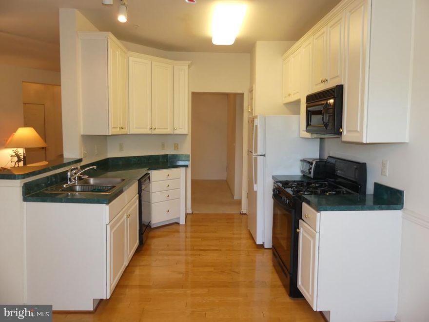 TOP FLR-ELEVATOR-FACES WOODS & TREES. ORIG OWNER-GENTLY LIVED IN 2BD/2BA. NEW HVAC-6-22. H2O HEATER REPLACED 1-16. EAT-IN KIT W/HWD FLRS, 42" CAB'S, GAS STOVE, B-IN MICRO, FRIG, CROWN MOLD, PANTRY & BREAKFAST AREA. LIV/DINE COMBO W/SLIDER TO SCREENED/PLEXIGLASS BALCONY. PRIMARY BEDRM W/W-IN & DBL CLOSET & W-IN SHOWER W/SEAT & GRAB BARS. BEDRM 2 AT OPP END W/JET TUB. LAUNDRY RM W/SMALL CHEST FREEZER & TALL CABINET. 5 CEIL/FAN LITES. CLUBHSE W/POOL, WORKOUT RM & TENNIS CT. SOLD "AS IS". FURNITURE CAN STAY IF BUYER WANTS.