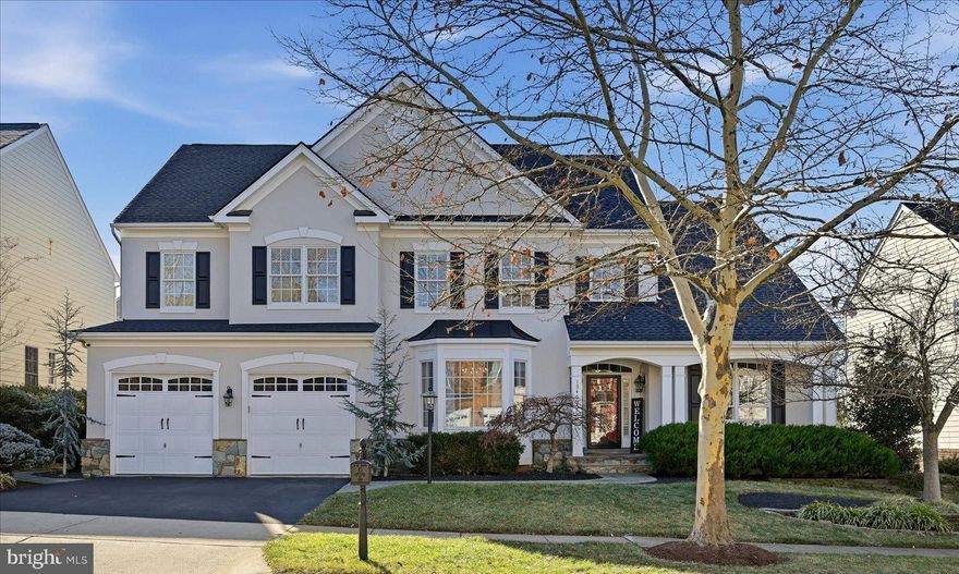 Step into a residence that redefines luxury living in the prestigious Lansdowne on the Potomac. From the moment you enter, abundant natural light, impressive ceiling heights, and an open architectural layout set an unforgettable tone that is grand in scale yet effortlessly welcoming. Refined details elevate the experience, including a dramatic two story tray ceiling, pristine hardwood flooring throughout, and a formal dining room with an impressive 12 foot ceiling. The entire interior and exterior have been freshly painted in a sophisticated neutral palette, enhancing both curb appeal and modern interior style.

The thoughtfully designed main level floor plan features an elegant office or library with a stunning custom floor to ceiling bookcase, formal living and dining rooms, and a spacious family room that flows into the freshly updated gourmet kitchen with new quartz surfaces and a stylish bar. The main level owner’s suite feels like a private retreat with custom closet organizers, along with the added convenience of main level laundry.

Upstairs offers three generously sized bedrooms and a beautiful loft sitting area, ideal as a second living space or cozy lounge.

The expansive walkup lower level delivers the ultimate entertaining and lifestyle space with an oversized bedroom, a massive recreation room, a dedicated theater room, a fitness studio, craft and storage areas, and a kitchenette designed for effortless hosting.

Outdoor living shines with a beautiful awning covered slate patio that provides the perfect setting for morning coffee, dining al fresco, or quiet relaxation.

Located in an amenity rich, resort style community with pools, a fitness center, courts, trails, and close access to shopping, dining, major commuter routes, Metro, and Dulles Airport, this home offers the luxury, function, and lifestyle today’s buyers wait years to find.