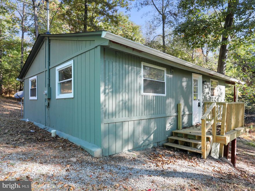 Welcome home to your newly renovated chalet near the back of Sleepy Hollow featuring tons of privacy and wildlife!  This 2 bed, 1 bath has vaulted ceilings and offers tons of new items to include: HVAC, kitchen, appliances, paint, lights, and LVP flooring.  Off of the back of the home there is a huge, vaulted, covered porch overlooking your private wooded lot.