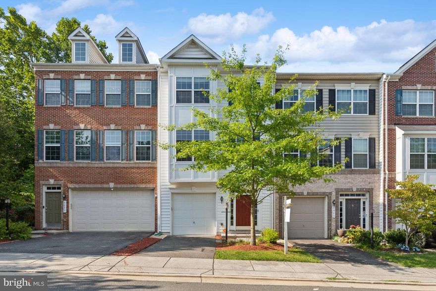 Available for you in a prime location is this  stunning 3-bedroom, 3.5-bath garage townhome nestled in the desirable Dominion Crossing community.  The comfortable floor plan has loads of space for everyday living and entertaining.  The kitchen is a a real beauty with stainless steel appliances and is ready for any chef to spread out on the large island, includes a dining area and bumpout breakfast room. 
The large primary bedroom on the upper level offers two large walk in closets, a generous ensuite bath with soaking tub and separate walk in shower. Two additional well-sized bedrooms on the same level share a full bath in the hallway. The laundy room is conveniently located on this level.
The lower level, which you enter the home by, features a full bathroom and large recreation room transforming into an extra living space with a sliding glass door that opens to the patio and back yard. This townhome is ideally located with the VRE Manassas Park Station just 1 mile away, making commuting a 
breeze. It is also conveniently close to commuter lots, shopping centers, and access to all roads leading to any area you desire.