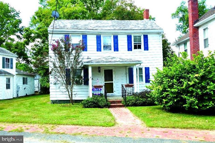 Enjoy the charm of small-town living in this delightful home, perfectly set on a large, private lot along a picturesque tree-lined street.

Step inside to a welcoming living room and a spacious country kitchen—ideal for everyday living and easy entertaining. The main level offers the convenience of a first-floor bedroom with beautiful heart pine floors that add warmth and character throughout.

Upstairs, you’ll find two additional bedrooms and a full bath, creating a comfortable separation of space. The kitchen is outfitted with stainless steel appliances including a gas range and refrigerator.

Relax on the inviting side porch or take advantage of the generous outdoor space featuring a large shed/back house, offering endless possibilities for storage, hobbies, or workshop potential.

A wonderful opportunity to enjoy privacy, charm, and room to grow—all in a lovely town setting.