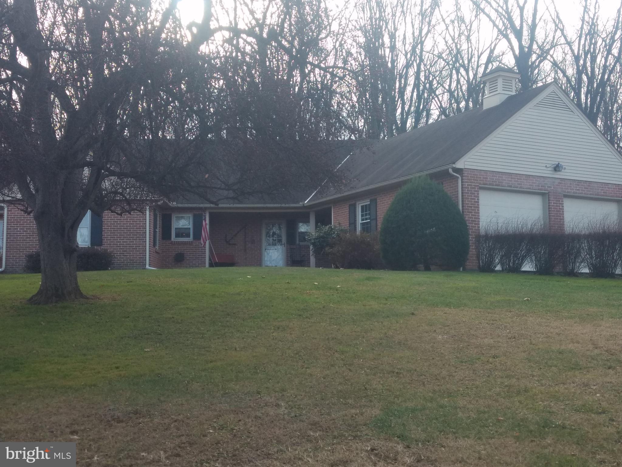 Welcome to 1613 Seven Valleys Road! Situated on partly wooded 7.62 acres, this beautiful custom built brick rancher offers many unique features. Including plank and Dutch doors throughout, beautiful hardwood floors, sunken living room with cozy working fireplace with wooden beam ceiling and much more. All closets are oversized offering plenty of storage space. First floor living at its best include an eat in kitchen, dining room, living room, den/office, 3 bedrooms, 2 full baths with washer/dryer on first floor. Enjoy natural at your outside firepit area in the woods or under the covered back patio. This well-maintained property is a MUST SEE!