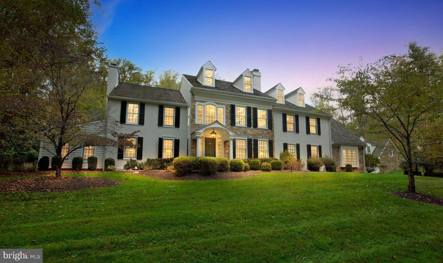 Welcome to 400 Dutton Mill Road, a beautifully updated private estate nestled on 4.7 acres in the coveted Radnor Hunt community. Offering over 5,000 square feet of comfortable elegant living space, lush landscaping, impressive hardscaping, and a luxurious pool w/ hot tub, all in a serene country setting on the Main Line. The gated entrance and winding drive set the tone for this charming manor with a classic yet contemporary vibe. Step into the impressive 2-story foyer with wainscoting, crown molding, and espresso hardwood floors that continue throughout. A formal Living Room features crown molding and beautiful arched built-ins that surround the wood burning fireplace, as well as offers an additional sitting area. The formal Dining Room with crown molding, handsome light fixtures & wall sconces, and adjoining butler’s pantry is a sophisticated space that makes hosting dinner parties a breeze. The chef inspired eat-in Kitchen with thoughtful details throughout boasts stylish two-tone cabinetry, high-end appliances & countertops, tile backsplash, center island with sleek range hood & counter seating, and a bright breakfast room w/ marble surround fireplace and access to the back patio, making this space perfect for casual meals with family & friends and dining al fresco in the warmer months.  A dramatic Family Room with dark tones, recessed lighting, beamed ceilings, wet bar, and a built-in shelving flanked stone fireplace offers a cozy space to gather, while the adjoining bonus room features cathedral ceilings, a gorgeous window allowing for plenty of natural light,  & outside access that lends itself to the perfect entertainment space. A corner office, oversized mudroom with storage, and Half Bath complete the first level. Head upstairs to the Primary Bedroom ensuite featuring two custom closets, gas fireplace, and gorgeous Full Bath with two vanities, frameless glass shower, and separate soaking tub. 4 additional Bedrooms, 2 Full Baths, and a laundry room complete this level. The Finished Basement provides plenty of space for a game room, playroom, theater, and additional storage. The tranquil back yard offers a serene setting to start and end your days, whether drinking coffee or tea on the blue stone patio, relaxing by the fire-pit, or taking a dip in the heated pool & hot tub. In addition, above the detached three-car garage is a fully finished living area with approximately 800 sq ft of living space w/ full bath that could be used as a pool house, au pair suite, or gym. Perfectly situated in the highly ranked Great Valley school district, and just minutes from local shopping & dining as well as major highways and public transportation, you won’t want to miss out on this truly remarkable home. ((Don't miss agent remarks for an additional incentive))