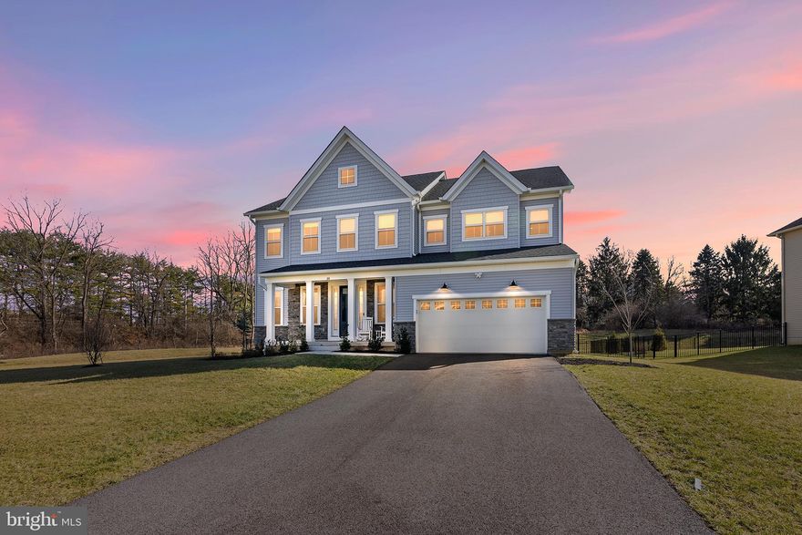 Why wait for new construction when you can move right into this stunning 2-year-old home located in the Reserve at Great Valley and the coveted Great Valley School District. With more than 5,000 square feet of living space, this beautiful 5 bedroom, 4.5 bath home offers a fabulous open floor plan and an abundance of natural light. As you pull into the driveway, you will notice the charming covered front porch which is perfect for relaxing and taking in the evening sunsets. Upon entering, take note of the beautiful natural luxury vinyl flooring and 10' ceilings, both of which continue throughout the entire main level. To the left is a large flex space, perfect for a formal Dining Room or Living Room. Continue down the hallway to a spacious Eat-In Kitchen complete with stainless steel KitchenAid appliances, custom tile backsplash, quartz countertops, custom pullout cabinet drawers, recessed lighting and pendant lighting over the large kitchen island with waterfall quartz top. The kitchen overlooks a spacious dining area which flows into the Great Room. Windows frame the space around the Great Room area offering picturesque views of the private yard and welcomes the natural setting inside the home. Continue to the convenient main floor bedroom (or possible private office suite) with ensuite full bathroom.  A half bath, as well as entry to the oversized two-car garage with Tesla charger, complete the main level. Sliding doors from the Great Room lead out to a custom stone patio which overlooks the flat, fenced rear yard, perfect for entertaining and for enjoying cool nights in the space you carve out for your fire pit. The upper level consists of a very large Primary Bedroom with a spacious walk-in closet and an ensuite full bathroom boasting an oversized seamless shower. Continue down the hall where you will find three more generously sized bedrooms, each with a large walk-in closet. One of the secondary bedrooms has an ensuite bathroom, while the other two bedrooms share a Jack-and-Jill style bathroom. Completing the upper level is a very spacious laundry room with granite counters. Looking for additional living space? No problem! An open staircase from the main level leads to a large finished basement complete with the same luxury vinyl flooring used on the upper levels of the home. There is also  "rough in" in the basement  for an additional bathroom"  A utility area and an additional storage room completes the lower-level. Convenient to shopping, restaurants, entertainment and more! Just minutes to the Chester Valley Trail, or meet neighbors and friends on the community's trail which circles the neighborhood. Easy access to major highways including Route 202, 76, and 476. Minutes from the Malvern Train station- making commuting into the City a breeze. This is a beautiful home in a wonderful community....Book your appointment today!