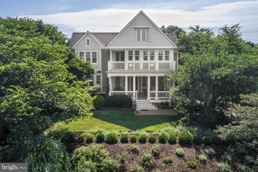 Elegant home boasts open floor plan and white oak floors. Gracious front porch overlooks lushly landscaped lot.  Renovated kitchen flows seamlessly into the cathedral ceilinged family rm, featuring 1800's reclaimed oak beams. Updates to master and guest bathrooms. Lower level includes office, recreation room, and wine cellar. Community Amenities.