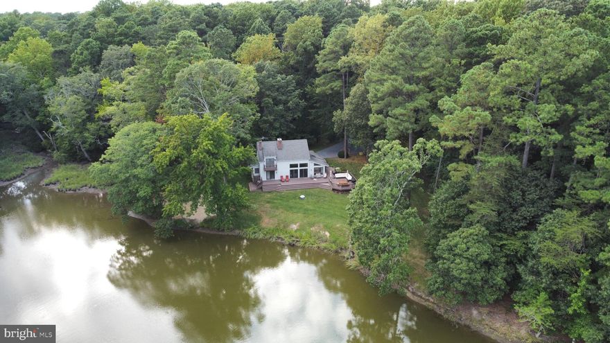 Welcome to the ULTIMATE Waterfront Cottage!  This private, 8 acre property, on the banks of Pickering Creek is surrounded by over 460 acres of protected environmental property!  If you are looking for the perfect waterfront getaway, but still have easy access to town...look no further!  A cozy cottage nestled in the woods in spotless condition!  Situated beautifully on the lot with great elevation, a sandy beach and spotless living.  An abundance of fine details and amenities, including Hardwood floors, two story family room, a deep, wood burning fireplace, first floor bedrooms, high speed internet, waterfront balcony, spacious deck, outdoor hot/cold shower, dog wash, fish cleaning station, 120' pier with boat lift, electric, water, jet ski lift, kayak launch.  The third floor bedroom has a balcony overlooking the water, and could easily serve as an entertainment room or bonus room with the openness and access.  THIS. PLACE. HAS. IT. ALL!  30 minutes to Bay Bridge, Less than 90 minutes from Washington DC, and 2 hours from Philadelphia.  Contact me today to schedule your private tour!