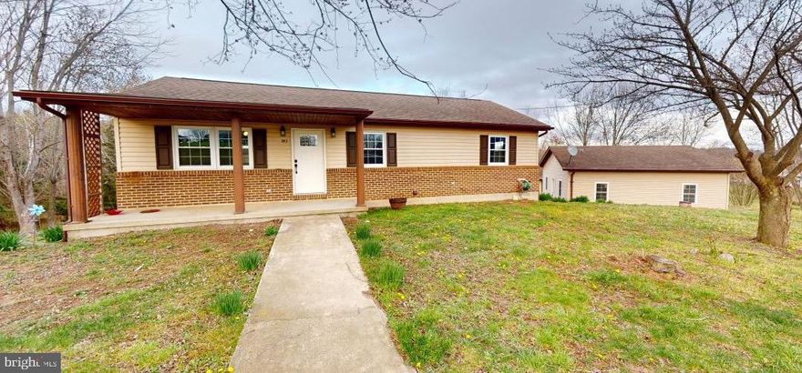 Just a short distance from  RT 50 in Augusta WV is this updated home on over 3 acres with many possibilities!  Main level consists of 3 bedrooms, 2 baths and open floor plan.  All new appliances and flooring.  Step outside the kitchen door onto a 2nd level  full length deck over looking a large back yard consisting of both wooded, some cleared acreage.  Lower level has several rooms including laundry, full bath, a room which was used as a kitchen and still has hook ups in place and a walk out door.  There is a room which could be used as storage and a room with a closet.  A larger room with walk out with a pellet stove.  One of these rooms could be that 4th bedroom. This area could be converted into an in-law space.  The large, 2 car detached garage is only steps away and has room to spare.  This location could be the right spot to live in the Hills of WV and commute to work in VA.