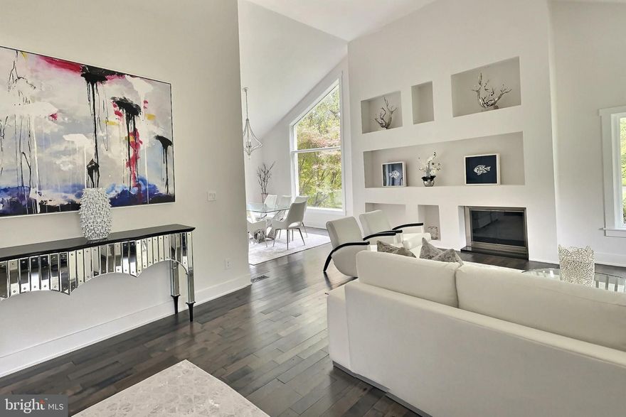 Offers will be reviewed late Wednesday. Welcome to a stunningly charming, contemporary modern gem in a fairy-like setting in the Potomac Outside neighborhood!  Located on a 2-acre corner lot beautifully situated to harmonize with the landscaping and lush greenery.   The carefully maintained interior exhibits lofty areas with beautiful cathedral ceilings, recessed lighting, and designer lighting fixtures. The dynamic floor plan offers 4 bedrooms  1 office/den space, 3 full baths, and a fully finished lowest level. This bright contemporary house with its unique design boasts superb details. As you come through the beautiful entryway, it welcomes you to an open dramatic area brimming with light.  The expansive living room and dining room with walls of windows provide views of the surrounding beauty of this pristinely kept lot.  The living area has built-ins with designer lighting to showcase the bright crisp white walls which make a stunning contrast with the beautiful hardwood floors throughout the house. The light-filled kitchen has Calacatta white quartz on counters and full backsplash. Including the waterfall island, Enjoy the generous size Sub-Zero refrigerator and top of the line Thermador appliances. Beautiful lightning adorns this thought out functional kitchen. The modern floating stairs ascend to the bedroom level which has a cathedral ceiling and skylights that flood the hallway with natural light.  You will find high ceilings and beautiful windows in the owner's suite, a large walk-in closet, and 2 more closets with ample cabinetry.  The master's bath has a dual vanity and large glass shower. A second generous size bedroom, lovely third bedroom /den, and full bath off the main hallway on this level. As you enter the Lower levels, you will find the huge fourth bedroom with an independent entrance, on the opposing end, an office space that leads to the two-car garage. Bring your Tesla! there is a charger for you to use. To finish this level you will find the laundry area with a granite countertop for your convenience and a full bath. The very lowest level provides a fun recreation room, a large window providing views of the wrap around gardens, mature trees, and beautiful landscape.  Access outside leads to the expanded flagstone patio nestled in the most peaceful and private setting.  As you go in the back of the house, among the trees you will find a quaint stone stairway that leads to a charming shed/art studio and extra storage shed. The feeling of serenity and total privacy make this stunning fairy tale setting truly a one-of-a-kind home. Enjoy proximity to Potomac Village, Country Clubs, amazing hiking trails along the Potomac River, C & O Canal and easy access to River Rd. and 495.