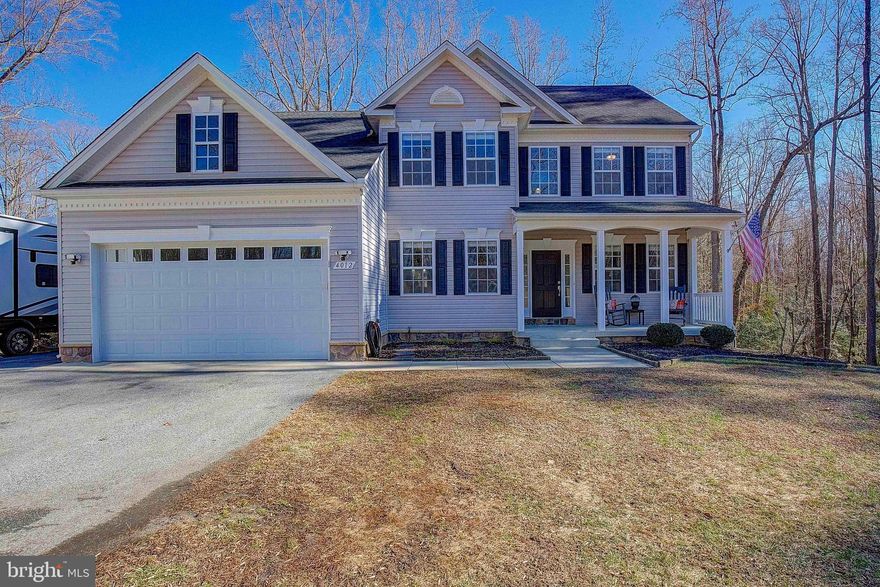 WOW this is a show stopper and it is ready for you!  Well cared for Colonial on a private 1.35 acre lot with no HOA  and located in a small subdivision. This home was built with the details in mind. From the open floor plan, wood floors, 30 amp service for a camper and a hot tub we are just getting started!  Take step inside and you will fall in love with the open and airy feel the 2 story foyer offers and leading you into your very own family room and kitchen. The large eat-in kitchen with nice cabinet space and room for a large table this is the perfect place to start your tour.  Overlooking the family room equipped with a gas fireplace, which is perfect for cool winter nights or relaxing. An abundance of natural light fills this space with all of the windows creating a warm and welcoming area to live.  The living room area is a nice location for a home office, kids play room and more.  The formal dining room easily can become anything you desire as well from a private office, craft room, dining room or kids play room.  This home offers a main level bedroom and full bathroom perfect for an in-law or just a spare room.  So many options with this desirable layout.  Upstairs offers you 4 full and large bedrooms and 2 full bathrooms.  Everyone wants the laundry on the upper level , well look no further this home offers you that and it is not small!  The primary bedroom is HUGE and has a HUGE closet to match!  The primary bathroom does not disappoint either with the oversized shower(amazing) and a nice soaking tub for all of the bath people.  The basement is ready for you to make your touch on this home.  Offering you a rough in for a bathroom, walk out level and plenty of space add equity into your new home and design this basement the way you desire!  All situated on over a acre of land in desirable Saint Leonard Maryland. This one is the one you have been waiting for so come and take a look, make an offer before it is gone!