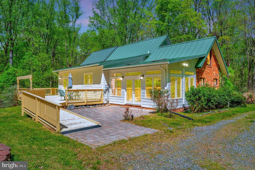 3 -4 Bedroom/3 Bathroom home in a Private Setting on 46 Acres .  This home is conveniently located near Dahlgren, Stafford, bridge to MD, and a short drive to Fredericksburg.  Open concept Living Area and Kitchen with Cathedral Ceilings and many other special features including Skylights, Built-ins, Decks on front and back of home, Patios on front and also on the side of the home at basement walkout.  Large basement with finished areas (one that could be used a bedroom) and also three rooms that can be used for Storage.  Home has 3 Full Bathrooms, one on each level.  Entrance to property through a Private Gate with a gravel driveway that winds through the trees to the home.  Also has a Generac whole home generator.