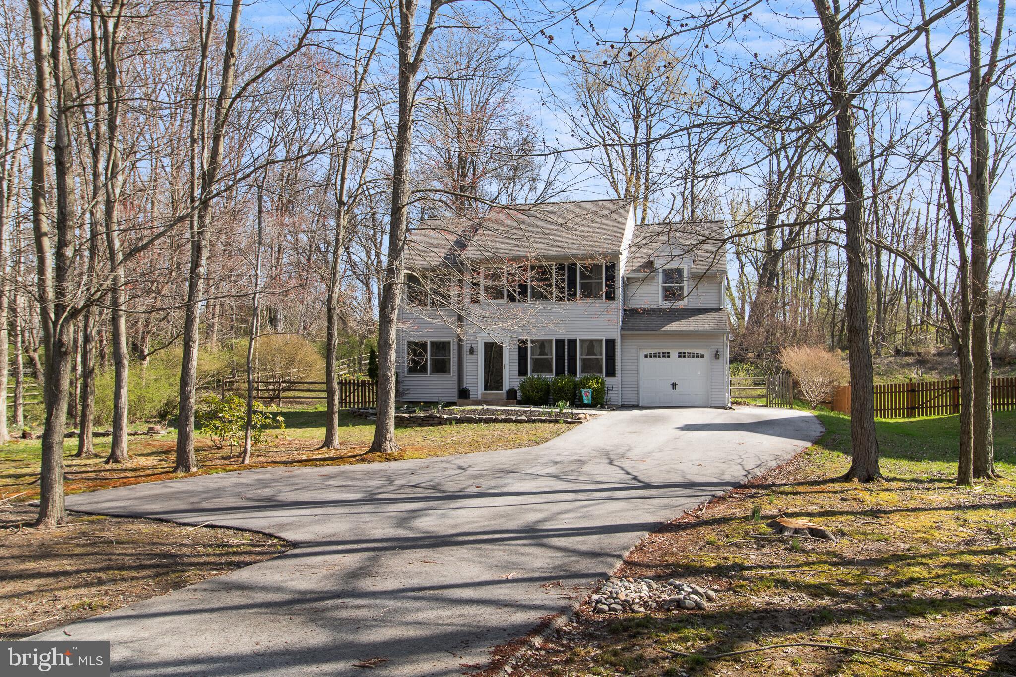 Great opportunity for a beautiful 4 bedroom, 2 1/2 bath colonial with a living room fireplace, in Hunters Woods. 2 story foyer, Master bedroom in-suite. Private wooded setting, on a cul-de-sac. A park-like large lot with extensive landscaping. Great oversized deck and patio overlook an expansive fenced yard with shed. Freshly carpeted, plus there are also 2 areas in the finished basement for a rec room and a work-out room. Laundry area just off the kitchen with front loading washer and dryer keeps things out of the way. Extra wide drive and additional parking pad. Much has been updated or is new: dishwasher, water heater, washer, dryer, HVAC, front door, carriage house garage door, shed, garbage disposal. Really a lovely home.