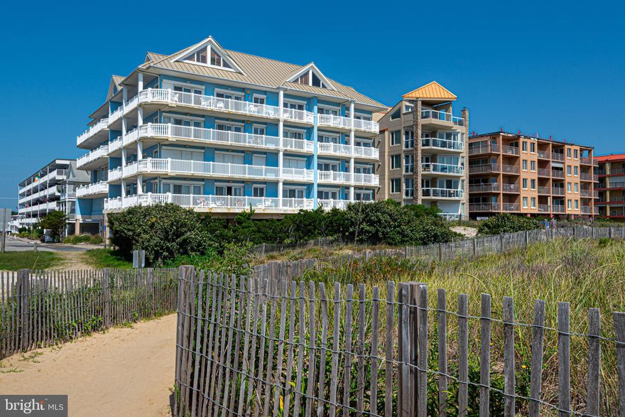Welcome to Carly E #402, a boutique oceanfront residence unlike any other.   Enter a world of coastal sophistication, where luxury and privacy meet the tranquility of the ocean. This remarkable 4-bedroom penthouse redefines oceanfront living with its sweeping panoramic views that stretch as far as the eye can see. The penthouse experience begins the moment you step off the elevator to your private foyer.  With the shimmering ocean as your backdrop, the open living spaces feature vaulted ceilings and a gas fireplace, perfectly complementing the boundless views. The heart of the home, the chef's kitchen, boasts custom details including Viking Professional appliances, inviting you to unleash your culinary creativity.  Soak up the sun on the wrap-around balcony stretching almost 100ft.  Retreat to the owner’s suite, a haven of tranquility with its own balcony overlooking the majestic ocean. The en-suite owner’s bathroom is a sanctuary of lavishness, featuring a 3-shower head shower, jacuzzi-style tub, and elegant dual vanities. There is another spacious en-suite bedroom on the west end of the penthouse.  The other additional bedrooms offer versatility, accommodating guests, work-from-home needs, or personalized spaces for relaxation. Ideal mid-town location, this penthouse is steps away from the beach and just one block from the Rt 90 entrance to Ocean City.  With only 9 total units in the Carly E and a private indoor pool, you'll relish the exclusive retreat this residence offers. Schedule a private tour today!