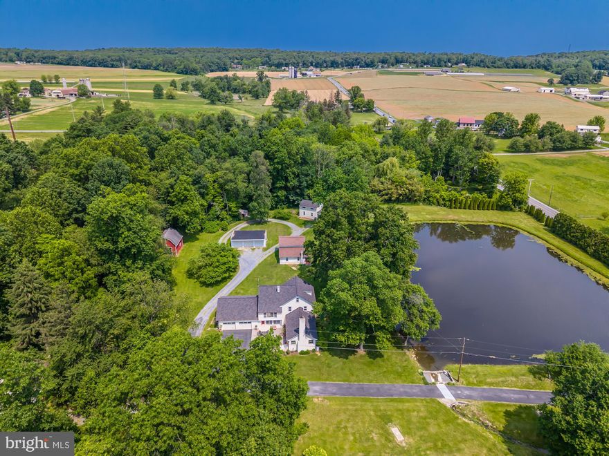 “On Golden Pond.” Here is your opportunity to own a valuable investment property with many possibilities. Situated on 4.8 beautiful acres with a 1+ acre pond, this well-kept property includes a main house with 4BR, 3BA, a 2-car, attached garage, and a spacious, separate third floor 1 bedroom, 1 bath apartment w/ private entrance. The main home is currently owner-occupied and features a large family room with propane fireplace and expansive views of the pond. The dining room also boasts lovely views of the pond and leads out to the front deck where you can relax and take in the water scene and its wildlife. There is a first-floor bath, an updated kitchen with a sitting room adjacent to it. Also on the first level is the laundry room, and a southern-facing sunroom with tile flooring and garage access. Just outside the sunroom is a large paver patio where you can enjoy your breakfast and listen to the birdsong or take in the stars and the fireflies on a new moon night. Upstairs you will find a large primary bedroom w/ WIC and a second sunroom, three more generously sized bedrooms, a full hall bath, and a large walk-in storage area above the garage.  There are also three cottages on the property which are currently leased with longer-term tenants. Two are 2 bedrooms, 1 and 1 1/2 baths w/ views of the pond. The third and smaller cottage is a 1 bedroom, 1 bath with a more private, wooded setting. Additionally, there is a detached 3-car garage that is currently used by the tenants but could be rented separately. A barn could also be rented for additional income or utilized for additional storage. This property can be enjoyed year-round with swimming, fishing, ice-skating, and gardening. With full tenancy and long-term leasing at proposed market rates, this property offers the new owner an estimated CAP rate of 7%. It also offers the possibility for short-term rentals, either monthly, weekly, or daily, which could net a much higher return. Think VRBO, Airbnb, or a bed and breakfast establishment. This is a highly desirable area with easy access to the turnpike, the train, Philadelphia, New York, Baltimore, and Washington DC. The property would be ideal for multi-generational living where the owner occupies the main house and other family members occupy one or all of the other units, or as an intentional community or retreat center. This is a one-of-a-kind property in a beautiful setting with loads of potential and great rental history. Don’t hesitate to book your showing today! Potential buyers are encouraged to consult with Honey Brook Township for all allowable uses.