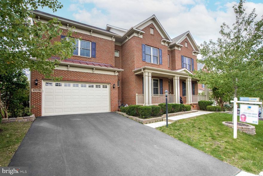 An exquisite, highly upgraded brick front Colonial Sedona model house with porch in the heart of Brambleton, North facing home with 10 foot ceilings an attractive front elevation and a rare find so close to the Bram town center, spacious living area (almost 6000 sq. ft), including crown moldings, chair railing, premium window shades, and Gorgeous hardwood floors throughout the 2 levels.
**Main level boasts a formal living, formal dining, stunning 2 story family room with gas fireplace, bedroom/office, main level full bath, Pooja room, Expanded Mud Room w/ Pantry & Storage, **Newly renovated gourmet kitchen with Quartz countertop waterfall, backsplash and plenty of counter space and room for counter seating., wolf appliance 6 burner rangetop and stainless steel appliances and double oven. Butler’s pantry. Breakfast area/sun room**
**Upper level offers 4 spacious bedrooms with ceiling fans and recessed lights. Luxury master bedroom and bath w/granite counters, sitting area, trey ceiling, spacious walk in closet with closet organizers and separate shower and soaking tub. Three additional generously sized bedrooms, one with its own bath, and two bedrooms sharing a Jack and Jill bath, provide ample space for family or guests. All bathrooms on the upper level have been upgraded with rain showers and premium tiles and counters**.
**Lower level is an entertainer’s paradise with luxury vinyl floors with two movie theaters with 7.2 channel and 5.1 channel premium sound systems and whole home automation and security system, a work out area, additional bedroom, rec room and a full-sized kitchen/wetbar with quartz counters with waterfall**.
**Outside is an entertainers dream: expansive stone patio/half-court basketball court, oversized trek deck, premium landscaping, lighting, and 7 zone irrigation system, Brand New (architectural shingles) roof, EV charge port in the garage and much more**. Short walk to Madison trust elementary School, Brambleton Middle and Independence High school, Hanson park.
**Brambleton Town Center is 2 mins away: Dining, library, movies, coffee, groceries, doctors, health club, gas station**.
**BRAMBLETON HOA INCLUDES- Community Verizon FIOS package for Cable and Internet, Brambleton has 20 miles of paved trails, annual events, art and farmer’s markets**. Enjoy the lifestyle so close to home. A must see.