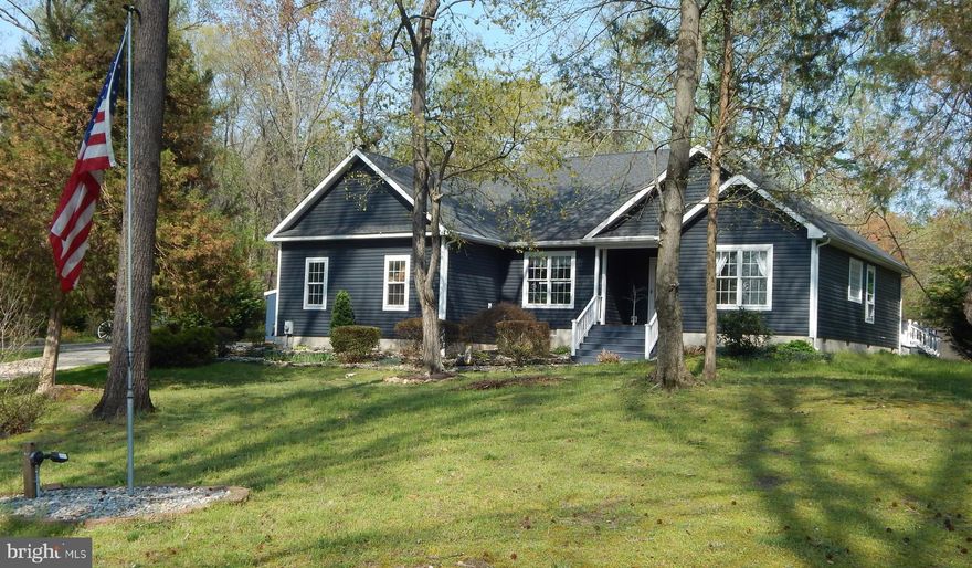 This is a lovely, well maintained, two story, three bedroom , two bathroom house on a peaceful 7 acres, close to 301 for ease of commute, yet secluded in a rural setting.  The Roof, Gutters, and Siding  were replaced in 2025.  The Furnace and AC Unit were also replaced in 2025. The majority of the home's flooring was replaced in 2024, and the bathrooms were redone.  There is a fenced area for the Dog's, with a smaller night time area.  The  stable was used for miniature horses.