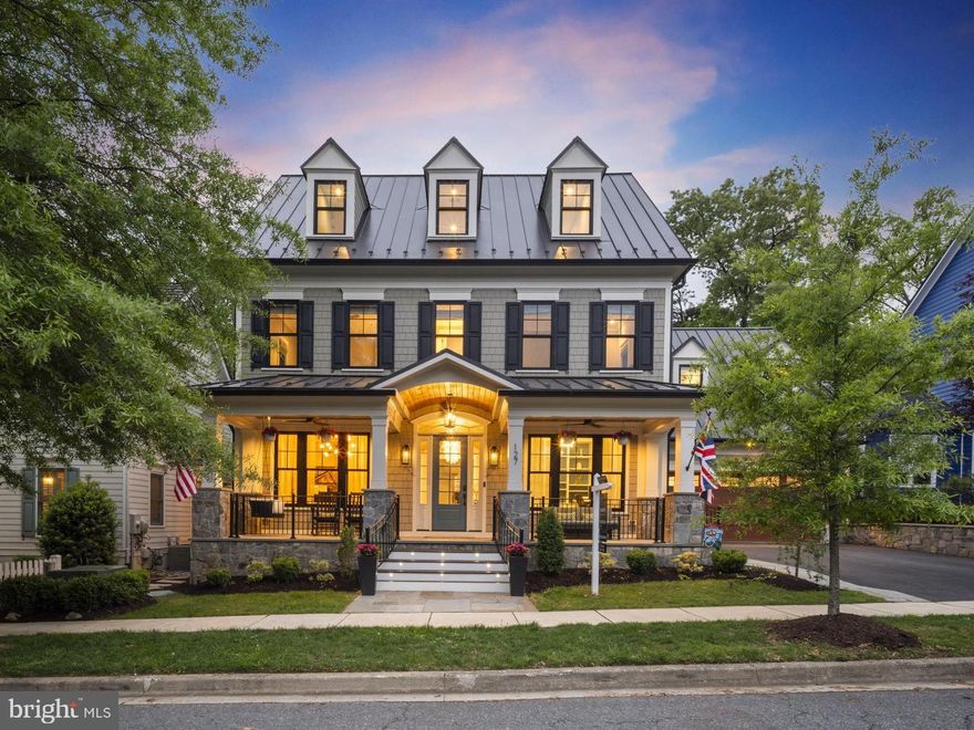 Situated in the coveted Kentlands community, 127 Thurgood Street presents an extraordinary expression of modern luxury, architectural sophistication, and resort-caliber living in one of the region's most walkable and beloved neighborhood settings. Completed in 2020 by prestigious local builder, Mitchell & Best and encompassing approximately 11,500 square feet, this exceptional residence blends timeless design with the comfort and efficiency of newer construction, and is ideally situated moments from the Kentlands clubhouse, pool, tennis and pickleball courts, basketball court, parks, lakes, playgrounds, walking trails, boutiques, and within walking distance to over 20 restaurants, bars and coffee shops.

A stately stone-front porch with a wood-paneled ceiling sets the tone for the craftsmanship found throughout. Ten-twelve ft ceilings across four finished levels, wide-plank hardwood flooring with built-in radiant heat establish an atmosphere of quiet refinement. The main floor features a dedicated music room with baby grand piano, a private office with custom built-ins, a formal dining room with tray ceiling, built-in cabinetry, and a family room anchored by a 50-inch gas fireplace with integrated surround sound.
At the heart of the home is an exceptional chef's kitchen with dual Cambria quartz islands and an elite suite of professional appliances, including a Wolf range with four gas burners and double-wide griddle, Miele refrigerator, freezer columns, two Cove dishwashers and custom cabinetry. The kitchen opens to an extraordinary four-season room and lounge with dramatic eight-foot recessed sliding glass doors. Radiant heated tile floors, retractable screens and a double-sided 42-inch gas fireplace, transforms this space into a year-round retreat. A mudroom with eight-person cubbies, built-in desk, farm sink and custom built-in closet completes the main level.

The second level is anchored by a primary suite of exceptional elegance. A fireplace, custom built-in bookshelves, and window bench create a sense of sanctuary, while a private sitting room with wet bar and wine refrigerator adds another layer of luxury. The spa-inspired primary bath features heated floors, a freestanding soaking tub with waterfall spout, a smart steam shower with aromatherapy, and a recessed waterfall shower. Dual custom walk-in closets and access to a private deck complete the suite. Four additional bedrooms, including 3 en-suites and a Jack-and-Jill suite with six-foot soaking tub and heated towel rack, plus a dedicated laundry room, offer beautifully finished accommodations.
The top floor adds two additional bedrooms, a full bath, and a yoga studio featuring its own secret bookshelf door. An elevator and thoughtfully integrated hidden passages throughout the home add a distinctive layer of charm.

The lower level is a destination unto itself complete with bar area and an inviting recreation room featuring a 50-inch gas fireplace, pool table, and 10-foot shuffleboard table complete the entertainment experience.  Enter the barrel-vaulted, wood-lined wine café into a custom wine cellar. Guests may want to stay in the hidden bedroom on this floor. Most extraordinary is the private indoor aquatic center featuring a built-in endless pool with dual resistance jets, heated tile floors, and custom Alex Turco wall murals. A fully equipped gym, five-person infrared sauna, and six-person Marquis hot tub complete this wellness retreat.
Outdoor living is equally well conceived, with a main-level deck featuring a built-in gas grill, pizza oven, and refrigerator. Two EV chargers, an in-ground smart sprinkler system, and whole-home and exterior sprinkler systems reflect the home's thoughtful integration of modern technology.
127 Thurgood Street is a truly rare offering: a move-in-ready estate of exceptional scale, craftsmanship, and amenity, set within one of the area's most admired communities.

$4,250,000 | Approx 11,500 Sq Ft | 8 Bed | 6 Bath | 2 Half Bath
