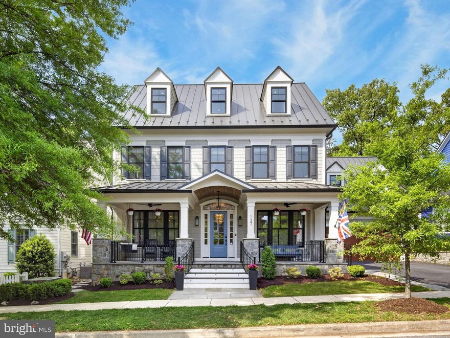 Nested in the coveted Kentlands community, 127 Thurgood Street presents an extraordinary expression of modern luxury, architectural sophistication, and resort-caliber living in one of the region's most walkable and beloved neighborhood settings. Completed in 2020 by prestigious local builder, Mitchell & Best and encompassing approximately 11,500 square feet, this exceptional residence blends timeless design with the comfort and efficiency of newer construction, and is ideally situated moments from the Kentlands clubhouse, pool, tennis and pickleball courts, basketball court, parks, lakes, playgrounds, walking trails, boutiques, and within walking distance to over 20 restaurants, bars and coffee shops.

A stately stone-front porch with a wood-paneled ceiling sets the tone for the craftsmanship found throughout. Ten-twelve ft ceilings across four finished levels, wide-plank hardwood flooring with built-in radiant heat establish an atmosphere of quiet refinement. The main floor features a dedicated music room with baby grand piano, a private office with custom built-ins, a formal dining room with tray ceiling, built-in cabinetry, and a family room anchored by a 50-inch gas fireplace with integrated surround sound.
At the heart of the home is an exceptional chef's kitchen with dual Cambria quartz islands and an elite suite of professional appliances, including a Wolf range with four gas burners and double-wide griddle, Miele refrigerator, freezer columns, two Cove dishwashers and custom cabinetry. The kitchen opens to an extraordinary four-season room and lounge with dramatic eight-foot recessed sliding glass doors. Radiant heated tile floors, retractable screens and a double-sided 42-inch gas fireplace, transforms this space into a year-round retreat. A mudroom with eight-person cubbies, built-in desk, farm sink and custom built-in closet completes the main level.

The second level is anchored by a primary suite of exceptional elegance. A fireplace, custom built-in bookshelves, and window bench create a sense of sanctuary, while a private sitting room with wet bar and wine refrigerator adds another layer of luxury. The spa-inspired primary bath features heated floors, a freestanding soaking tub with waterfall spout, a smart steam shower with aromatherapy, and a recessed waterfall shower. Dual custom walk-in closets and access to a private deck complete the suite. Four additional bedrooms, including 3 en-suites and a Jack-and-Jill suite with six-foot soaking tub and heated towel rack, plus a dedicated laundry room, offer beautifully finished accommodations.
The top floor adds two additional bedrooms, a full bath, and a yoga studio featuring its own secret bookshelf door. An elevator and thoughtfully integrated hidden passages throughout the home add a distinctive layer of charm.

The lower level is a destination unto itself complete with bar area and an inviting recreation room featuring a 50-inch gas fireplace, pool table, and 10-foot shuffleboard table complete the entertainment experience.  Enter the barrel-vaulted, wood-lined wine café into a custom wine cellar. Guests may want to stay in the hidden bedroom on this floor. Most extraordinary is the private indoor aquatic center featuring a built-in endless pool with dual resistance jets, heated tile floors, and custom Alex Turco wall murals. A fully equipped gym, five-person infrared sauna, and six-person Marquis hot tub complete this wellness retreat.
Outdoor living is equally well conceived, with a main-level deck featuring a built-in gas grill, pizza oven, and refrigerator. Two EV chargers, an in-ground smart sprinkler system, and whole-home and exterior sprinkler systems reflect the home's thoughtful integration of modern technology.
127 Thurgood Street is a truly rare offering: a move-in-ready estate of exceptional scale, craftsmanship, and amenity, set within one of the area's most admired communities.