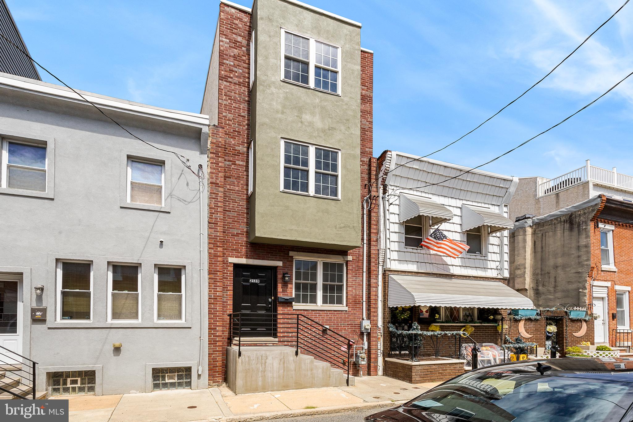 This gorgeous 3-story townhome offers location and amenities galore. Located on one of the best blocks in beautiful Point Breeze. Minutes from Center City and UPenn you'll have everything the City has to offer at your door step. Highlighted by its open layout, high ceilings and gleaming hardwood floors the entire townhome has an elegant and inviting feel. The first floor centerpiece is the spacious kitchen, which features a gleaming white palette, stainless steel appliances, including a built-in microwave, dishwasher, and gas oven. The ample counter space and island are a chef's dream. The open concept design creates the ideal setting for gatherings with friends and family. The second floor features two bedrooms (each with full closet) and a hall bathroom. The third floor bedroom with ensuite bathroom, huge closet - and roof deck offers a touch of privacy and sense of retreat. But the amenities don't end there! This townhome also offers a fully finished basement providing additional living space that can be used as a recreation room, home office, or media center. The laundry is conveniently located on the upper level. Outdoor living is a delight with a back patio, offering a peaceful space to relax, garden and barbecue. This townhome offers easy access to shopping, dining, entertainment, and transportation options. Schedule your showing today, you will not be disappointed.