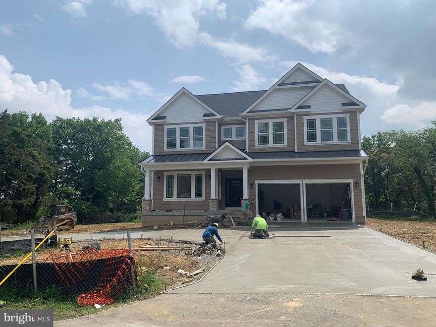New Construction on this Stately Craftsman Home with a Aug 2023 Delivery!  Spread out on this rare 3/4 acre lot so close in! Home offers 5414 finished living square feet plus 2 Car Gar & Front Porch. Ample parking for the “toys” with Circular drive plus a 4 Car Driveway. The lot is nice & level and promises many evenings of peace & quiet with this hidden & secluded location and yet so handy to the Huntington metro station (Just 1 mile) and numerous restaurants, Target,  Lowe's, Outback, Panera Bread, Old Town Alexandria, and near 2 new developments. 
Ceiling heights: Main, 10', Upper 9', LL 9'.  The Main Level boasts 10’ ceilings, Hardwood Floors and an elegant Foyer with Artisan moldings which carry through to the formal areas. The spacious family room features a gas fireplace with shiplap that opens to a Gourmet Kitchen with large marble island, bar seating, separate wet bar, walk in pantry, top of the line Stainless Appliance package, two toned European Cabinets & a Farmhouse Sink. The Breakfast Room offers easy access to the large backyard with private expansive views. The Landscape plan is posted in the documents section.
The Living & Dining rooms are done with beautiful wainscoting, recessed lighting, and large windows. An oversized 2 Car Garage, mudroom & powder room finish off the main level. Upstairs there is a large Primary Bedroom with Trey Ceilings, 2 Walk ins, a Spa Like Bath, w/Double Vanities, Large Shower with bench & stand alone tub. 3 extra generous Bedrooms, one with an ensuite bath & two with a shared Buddy Bath.
The finished Walkout Lower Level offers a 2nd Family Room with high ceilings, the 5th BR and another full bath, & two flex rooms to use as you see fit. Home Theater, Home Office or Fitness Room. Rare opportunity for a New Construction Build on a 3/4 acre lot with Hardiplank Siding all 4 sides. This home is only 20 mins from Amazon HQ2 & National Airport, and 25 mins to Pentagon/Wash DC. Builder preferred lender is Intercoastal Mortgage.  See documents for Lender info & Builder Floor plans. Similar new construction homes on smaller lots are being offered at 1.5 mil!  This New Build is a Huge Value! Tax Value is yet to be determined, only estimated on this listing.