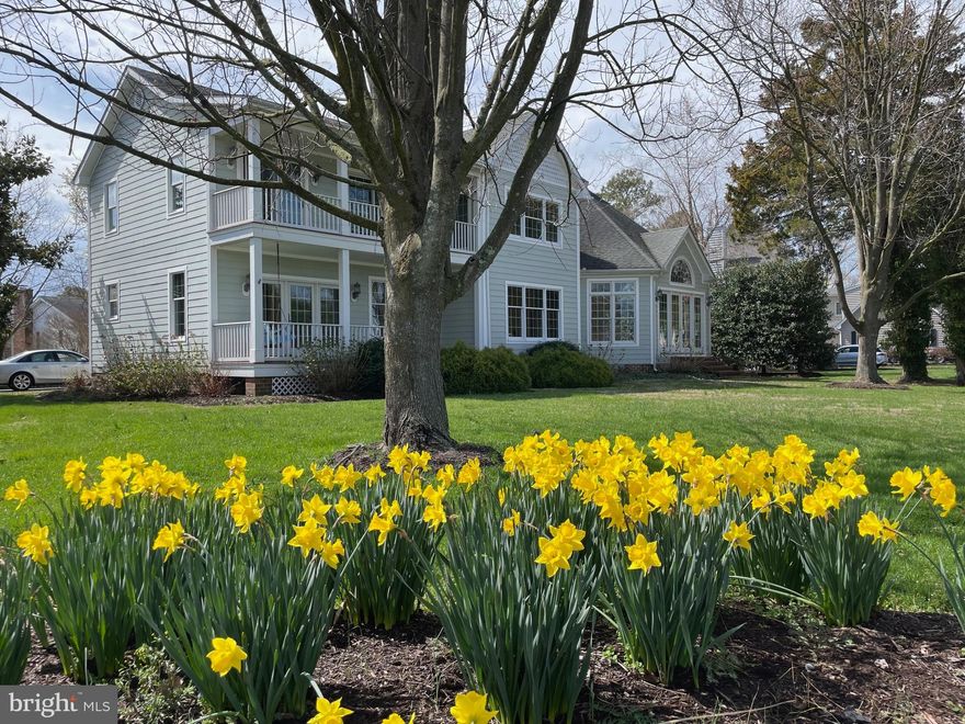 Don't miss this rare opportunity. This special home offers spectacular and picturesque views of the Saint Michaels Harbor in addition to its prime location on one of Saint Michaels most desirable streets.  Conveniently located near all of the in-town amenities and walkable to great restaurants, shops, brewery, winery, gallery, seasonal farmer's market, museums and more.  This home has received a fresh interior painting, a deep cleaning and it is "move in ready"
It is a 4-bedroom, 3 full bath and 1/2 bath home with the 1/2 bath on the first floor. One of the bedrooms and a full bath is a guest apartment with a kitchenette located over the 2 car attached garage.  The guest apartment is accessible from the inside of the home or by a private outside entrance.  The Primary Suite includes an updated en-suite Bath with double vanity, walk-in shower and private toilet. The Primary bedroom has room for a king-size bed, a walk-in closet, a north harbor view and access to the 2nd floor front porch. The 2 additional bedrooms have large closets, harbor views and individual access doors to the front porch.  Both bedrooms share a large, updated bathroom with a combination tub/shower.   The main part of the home is both comfortable and casual while at the same time stately and refined. The kitchen and eat in breakfast /dining area looks out over the Harbor and opens to the 1st floor porch and porch swing which is a great place to have your morning coffee.  The kitchen has a great layout, granite counter tops, stainless appliances, a Viking paneled refrigerator and a walk-in pantry.  The Dining room or living room has a harbor view as well and a central fireplace with attractive marble and millwork.  The architectural marvel of this home is the "Conservatory".  It is a fantastic room for entertaining with a double height ceiling and intriguing structure.  This was in use as a great room / family room.  The back wall could also accommodate a large bar and flat screen if desired.  If interested, a future owner might consider it for a master suite.  Two sets of French doors open to either the front lawn or side yard for entertaining. The unique design of the conservatory also provides a near 180-degree view of the harbor and all of the sunrises and sunsets.  
With the lowest price per square foot for a Luxury, Waterview, in town home, it is also a comparatively excellent value.