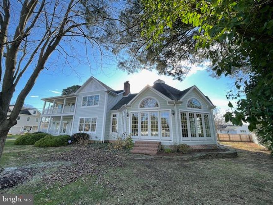 Don't miss this rare opportunity. This special home offers spectacular and picturesque views of the Saint Michaels Harbor in addition to its prime location on one of Saint Michaels most desirable streets.  Conveniently located near all of the in-town amenities and walkable to great restaurants, shops, seasonal   farmer's market, museums and more.  This home has received a fresh interior painting and is "move in ready"
It is a 4 bedroom, 3 full bath and 1/2 bath home with the 1/2 bath on the first floor. One of the bedrooms and a full bath is a guest apartment with a kitchenette located over the 2 car attached garage.  The main part of the home is both comfortable and casual while at the same time stately and refined. The kitchen and eat in breakfast area looks out over the Harbor and opens to the 1st floor porch and porch swing which is a great place to have your morning coffee.  The kitchen has a great layout, granite counter tops, stainless appliances, a Viking paneled refrigerator and a walk-in pantry.  The Dining room or living room has a harbor view as well and a central fireplace with attractive marble and millwork.  The architectural marvel of this home is the "Conservatory".  It is a fantastic room for entertaining with a double height ceiling and intriguing structure.  This was in use as a great room / family room.  The back wall could also accommodate a large bar and flat screen if desired.  If interested, a future owner might consider it for a master suite.  The unique design of the conservatory also provides a near 180-degree view of the harbor and all of the sunrises and sunsets.