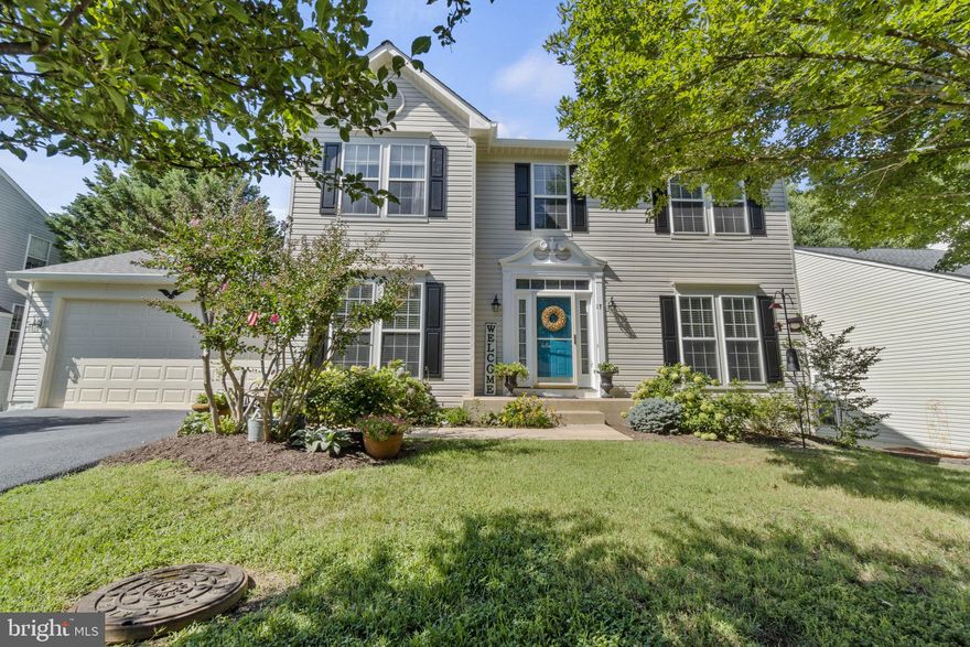 Lovely Colonial in desirable Autumn Ridge Neighborhood!   This home has so much character with a beautifully landscaped lot!  As you make your way into the front door where you will find the foyer with hardwood floors through the hallway, kitchen, and morning room!  The dining room features ample lighting, crown molding, and chair railing.  The living room is spacious and can also be used as a home office! As you enter to the back of the home you will find a cozy family room, with lots of windows,  and a wood-burning fireplace!  The family room is off of the kitchen and has an eat-in breakfast area!  You will enjoy cooking as you're watching TV or visiting with loved ones! Make great use of your kitchen island, granite counters, and stainless appliances! You will absolutely love the morning room that opens up to the back of the house.  Make this an eat-in room,  home office, a sitting room, or a reading room.  Enter outside in the morning to a double deck that is a low-maintenance, trex decking!  Fully fenced yard that backs to trees for extra privacy! Upstairs you have a spacious master suite!  Vaulted ceilings and a walk-in closet that has a "Closets by Design" closet system!  The master bath has a dual vanity, new fixtures, and a new master bath shower surround!  3 additional spacious bedrooms upstairs, 2 of which also have "closets by design". The basement has a blank slate but plenty enough room for your own design!  There is a rough-in for plumbing and a walkout to the rear yard!  Make it a hang-out area or home gym! Other features of the home include a new driveway in 2021,  newer kitchen and bathroom fixtures,  newer paint, carpet, and hardwood flooring.  The location is amazing!  SO close to schools, shopping, commuter lot, I-95, Quantico and so much more!