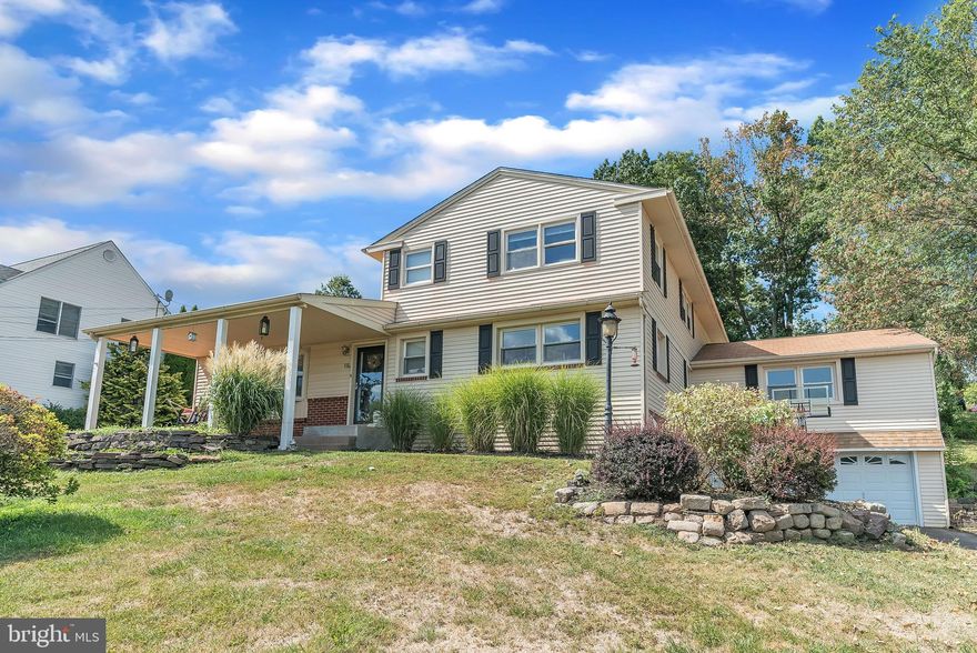 Located in Chalfont Borough of Central Bucks County, this 4-bedroom, 2.5-bathroom home has approximately 3,000 SF of living space on just about a half-acre of property overlooking Hellberg Avenue in the quaint community of Rosemore Estates. As you approach the home you can’t help but notice the large covered front porch, which is nothing short of welcoming and a perfect place to sit, relax, and enjoy the day rain or shine. As you enter the home through the front door, you will immediately notice the open floor plan and beautiful engineered hardwood flooring that runs throughout most of the main living level. The kitchen is updated and bright, featuring all the modern upgrades including white shaker cabinets, quartz countertops, a tile backsplash, farmhouse sink, a large island with seating, and even some built-in shelving. Just off the kitchen is a room currently used as a eat-in kitchen type dining space. This room is 22x13 and can alternatively be set up as a living room space for more of an intimate gathering/entertaining space while in the kitchen. On the opposite side of the foyer is the more formal dining room, half bathroom, and an office/den, or even a 5th bedroom. Moving toward the back of the home is a large living room that features a coffered ceiling and an electric insert fireplace with mantle and decorative tile surround. A double door to the back patio and multiple windows provides for lots of natural light during the day. Also, in the back of the home, adjacent to the living room, there is the fourth bedroom. This room could potentially serve as a main floor master bedroom (16x12), as it currently includes a large laundry closet and an additional unfinished room that can become a 3rd full bathroom. Heading upstairs are 3 spacious bedrooms, each with plenty of closet space, and a fully renovated hall bathroom. The bathroom features beautiful tile, double sinks, a glass enclosed stall shower, and soaking tub. The lower level is accessible from inside the home or from the driveway outside. The lower level is partially finished and has a small full bathroom. The unfinished basement space will provide for plenty of additional storage space. Other great features of this home include a 2-car garage, inground pool, public water and sewer, hot water oil heat, central A/C, all in the Central Bucks School District!